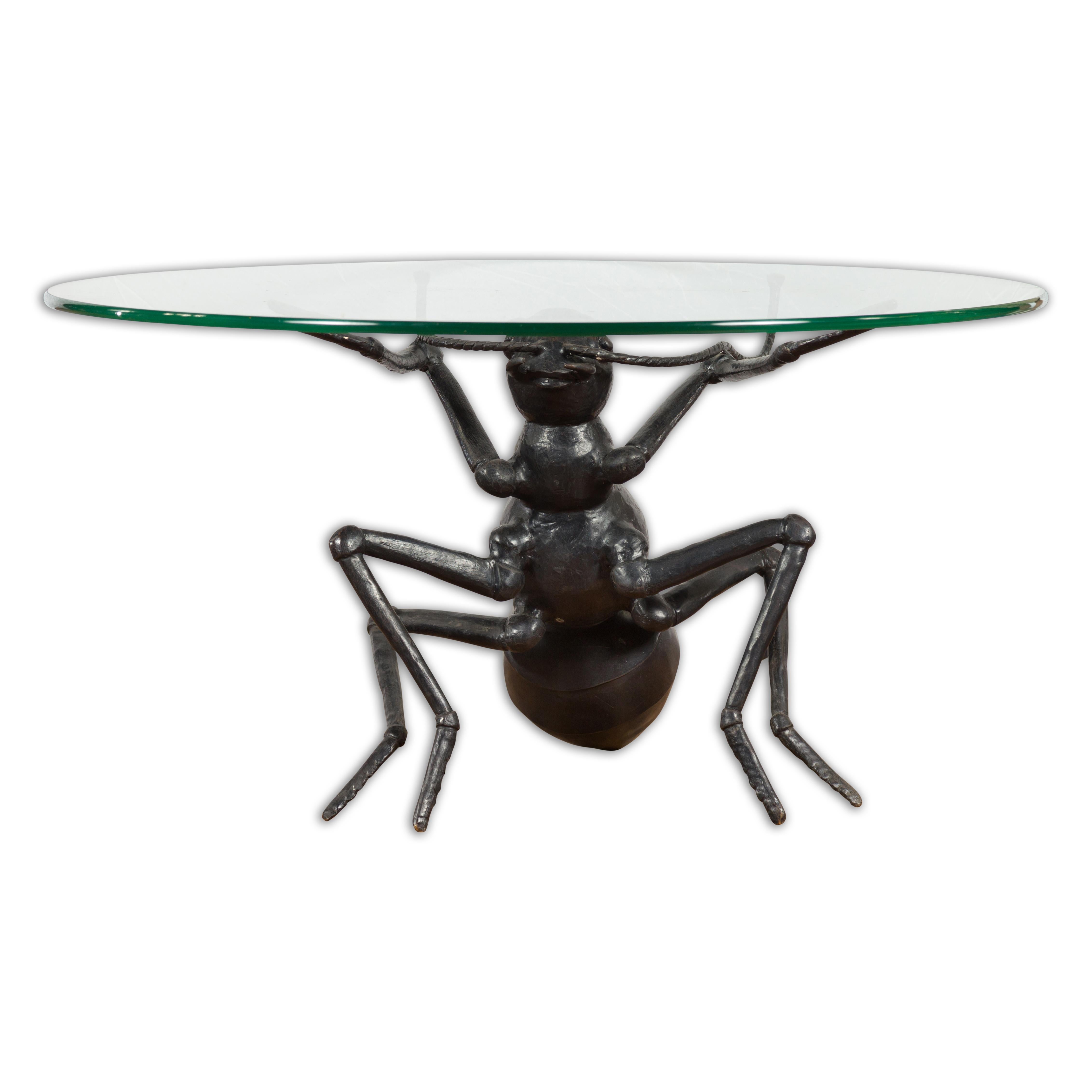 A contemporary lost wax cast bronze coffee table base sculpture from the 21st century depicting an ant. Created with the traditional technique of the lost-wax (à la cire perdue) which allows for great precision and finesse in the details, this