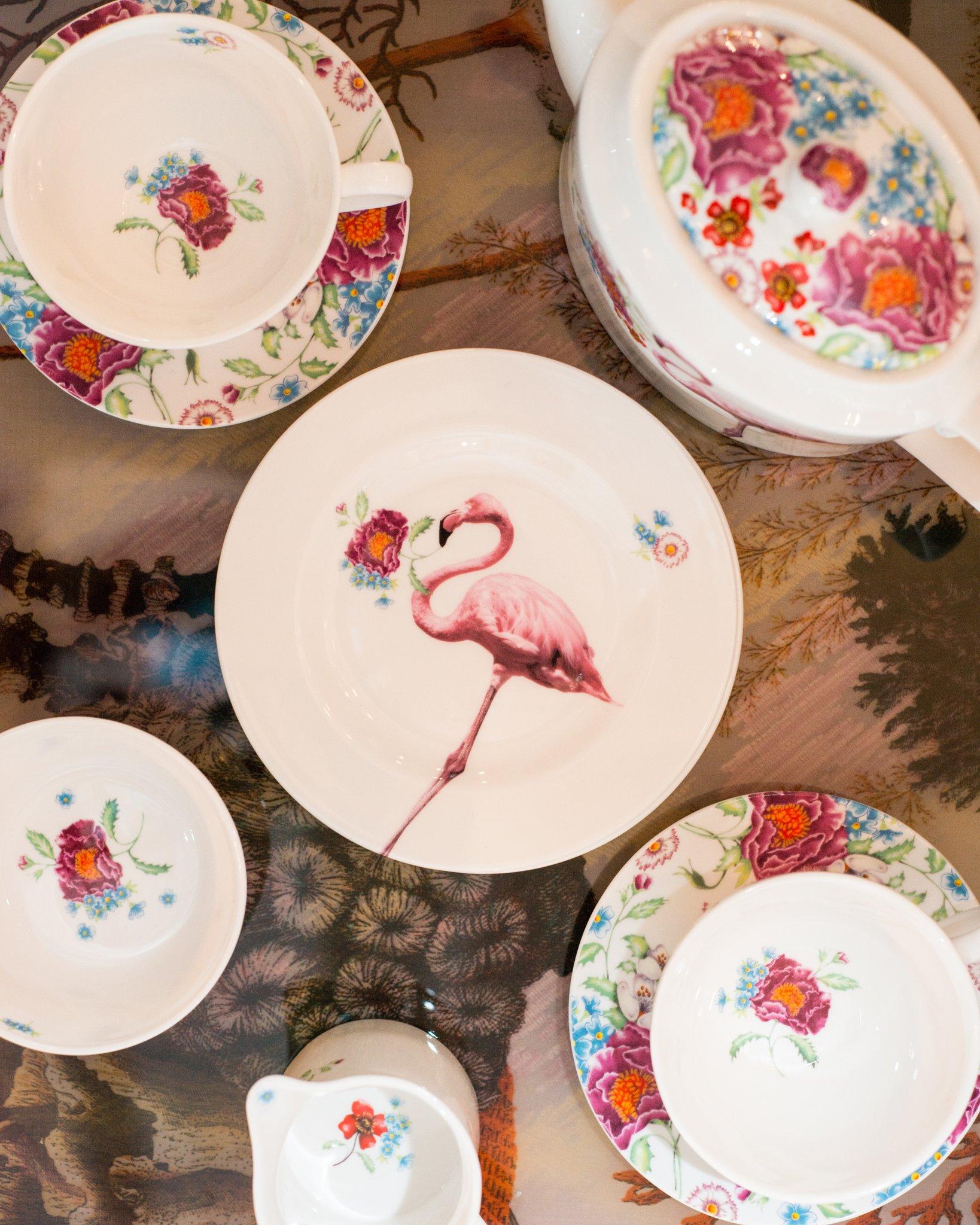 A chic fine bone china tea set with flamingos from Lou Rota, London. This sophisticated set includes one teapot, one creamer, one sugar bowl, six teacups and saucers and six tea plates. Dishwasher safe.

Measures: 4