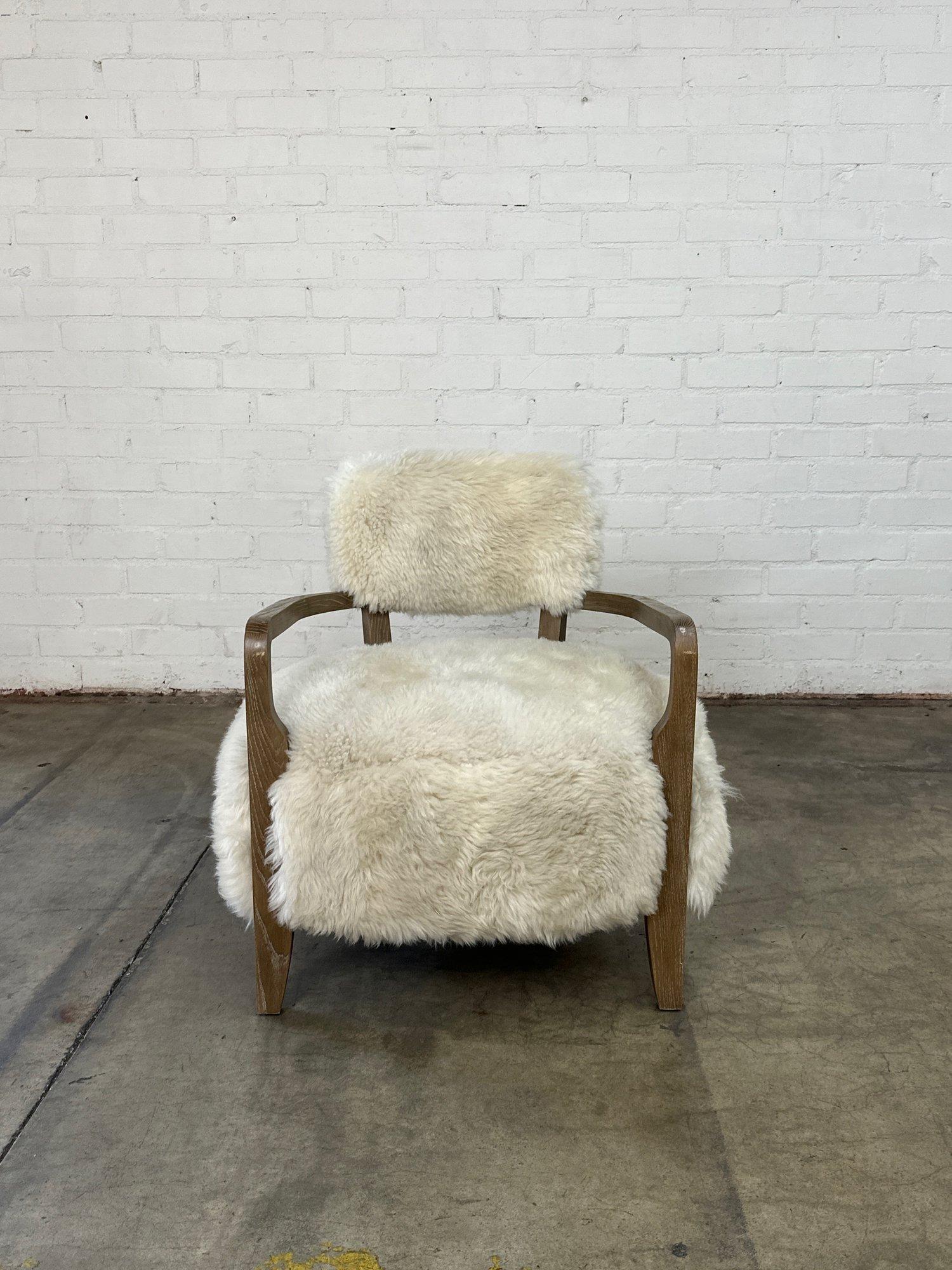 W30 D27 H31 SW24 SD21 SH17 AH24

Royce Lounge Chair by Interlude home in great gently used condition. Item shows well with no visible breaks or large damages to wooden frame. Sheepskin upholstery areas also are well preserved with no visible stains