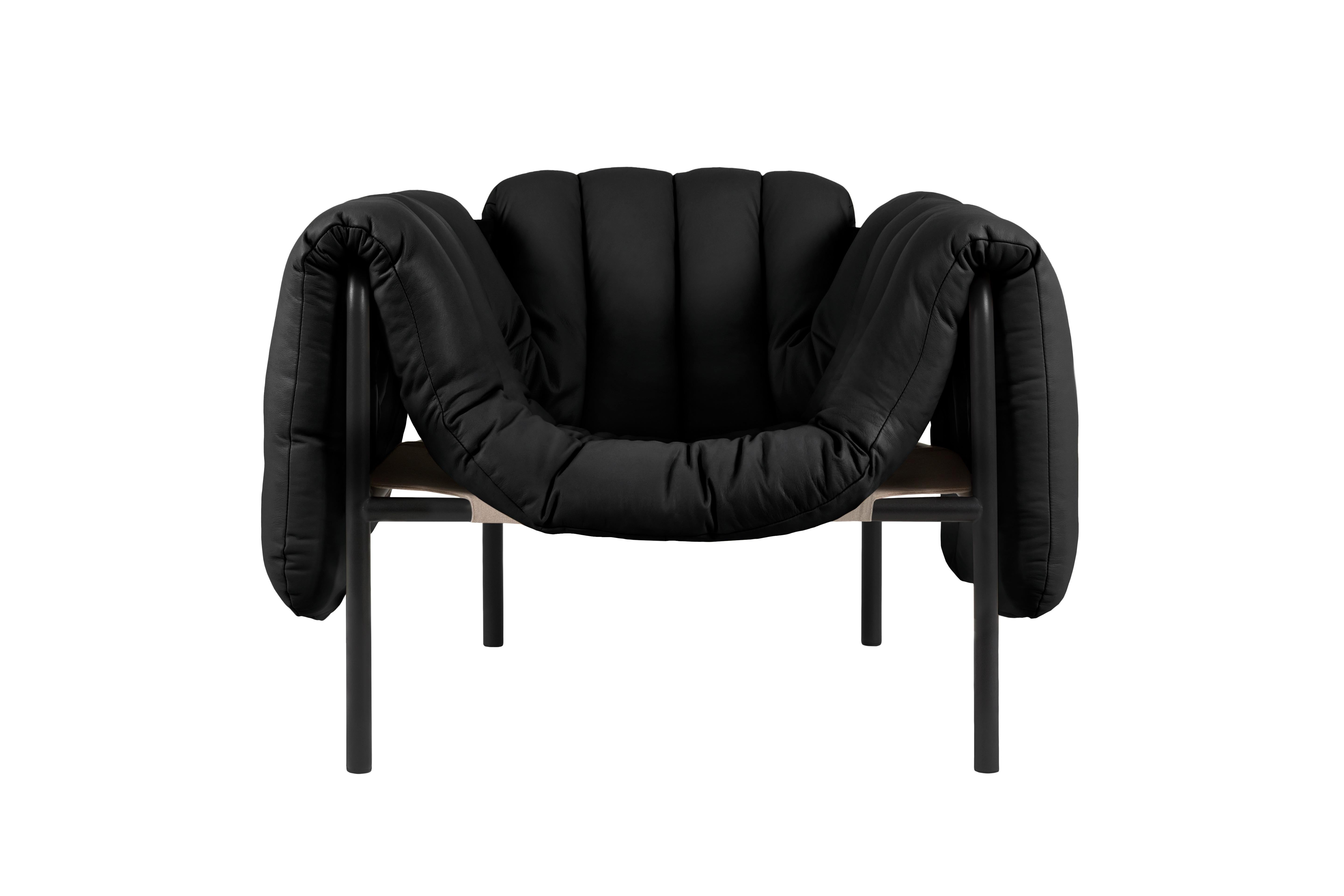 PUFFY, Lounge Chair
Design: Faye Toogood
Editor: HEM

Model shown on main image: 
Steel frame: Black Grey, Matte
Upholstery: Soft Leather, Black, Elmo

The detachable upholstery of the Puffy Lounge Chair is fat and plump, its generous shape spills