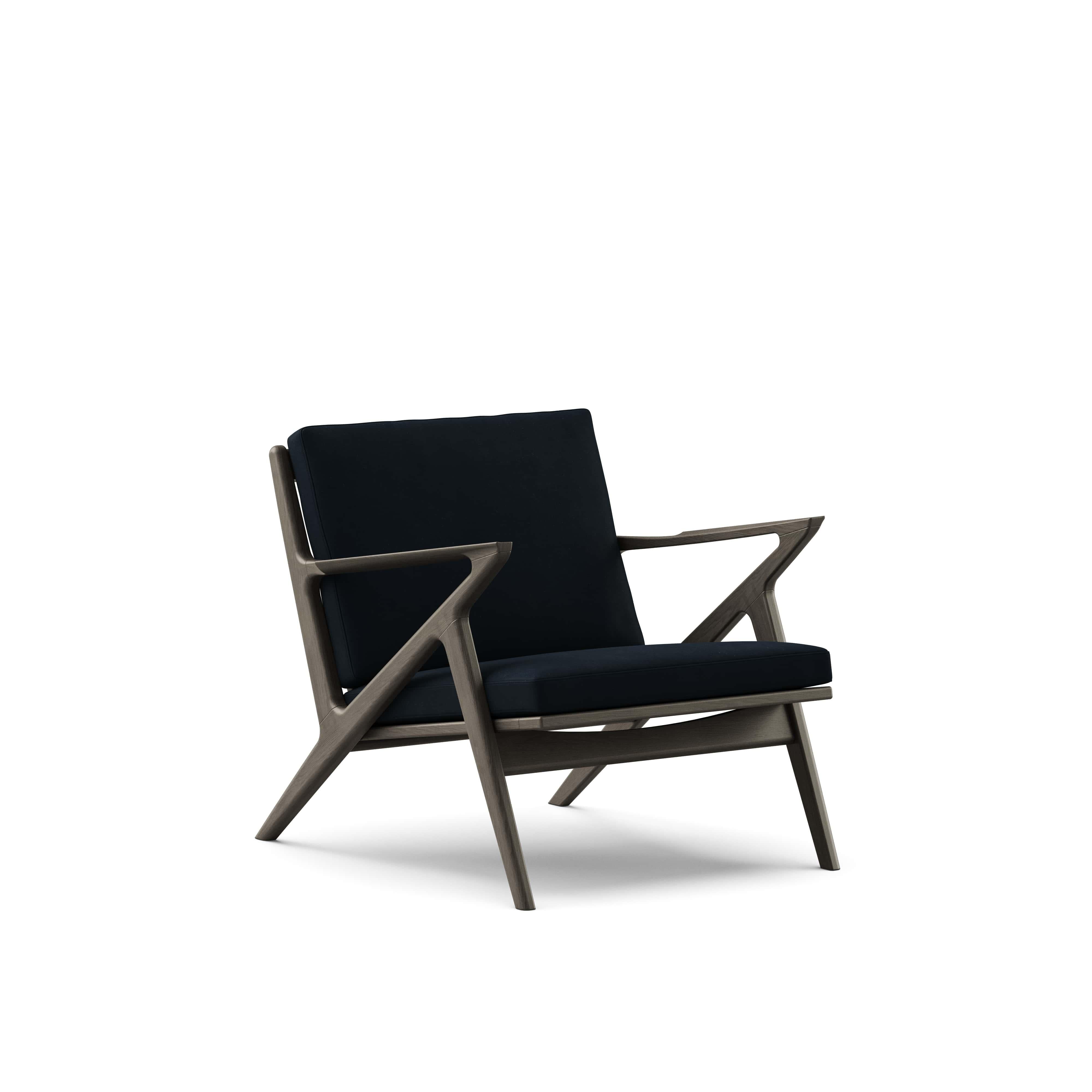 Zeitgenössischer Loungesessel 'Z-Chair' von DK3
Entworfen von Poul Thorsbjerg Jensen

Abmessungen: 
- B.75 x T.82 x H.62 cm
- Sitzgelegenheit: B.58 x T.52 x H.36 cm

MATERIALIEN: 
- Rahmen: Massivholz.
- Sitz und Rückenlehne: Polsterung.

Modell auf