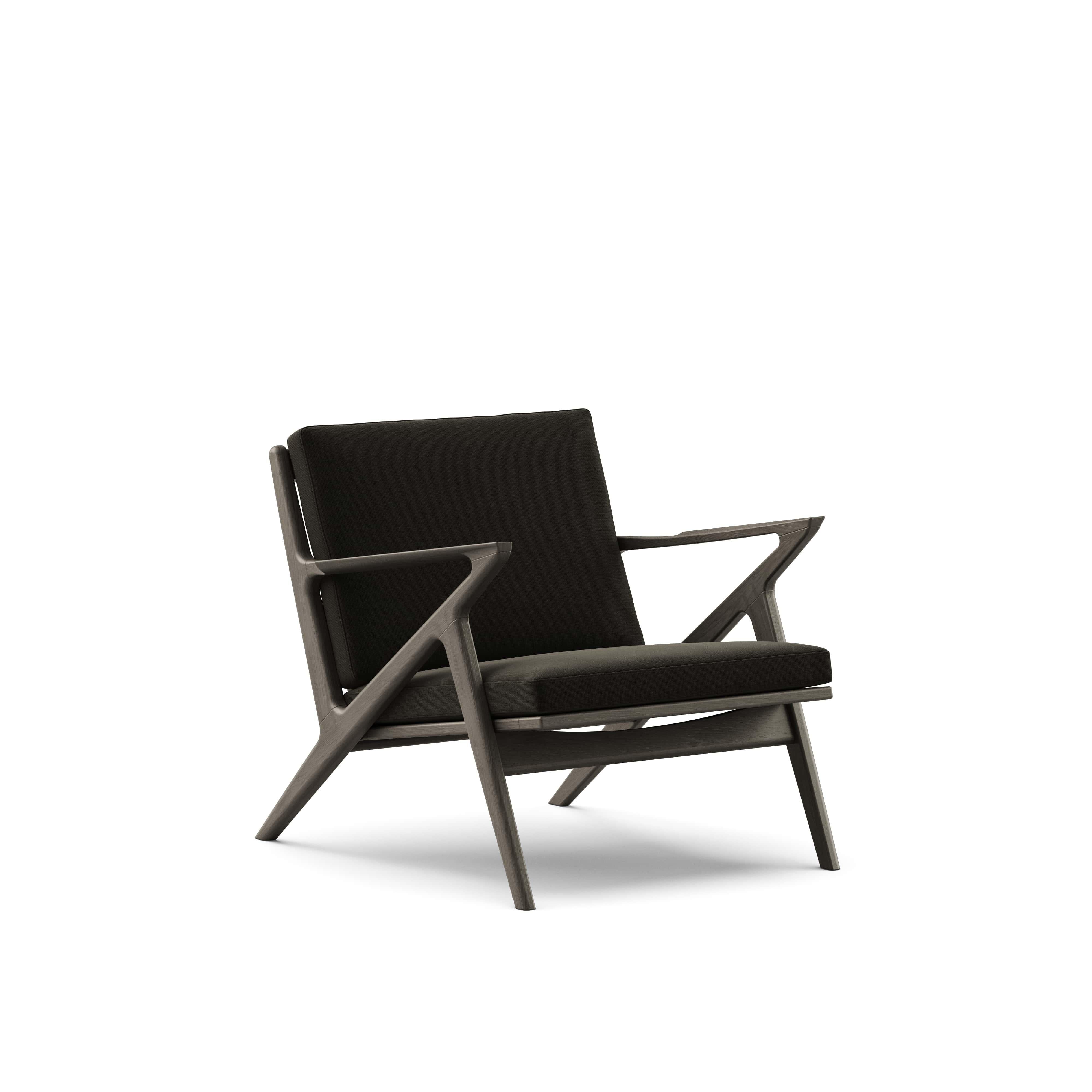 Silla de salón contemporánea 'Z-Chair' de DK3
Diseñado por Poul Thorsbjerg Jensen

Dimensiones: 
- An.75 x Pr.82 x Al.62 cm
- Asiento: An.58 x Pr.52 x Al.36 cm

Materiales: 
- Estructura: Madera maciza.
- Asiento y respaldo: Tapizado.

Modelo