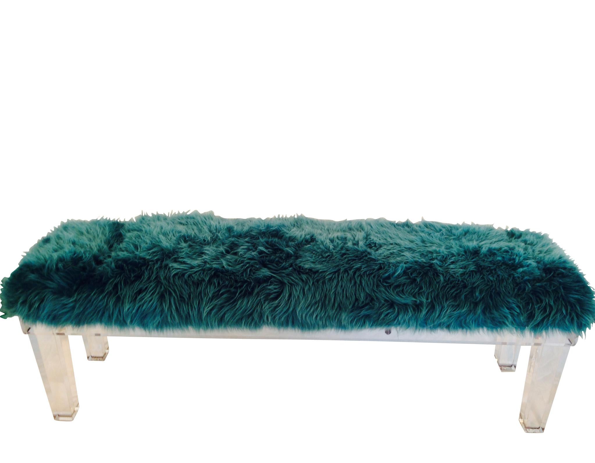 21st Century Modern custom crafted thick solid leg Lucite bench with Mongolian fur teal colored pelt upholstered top.  New-never used-floor sample.


