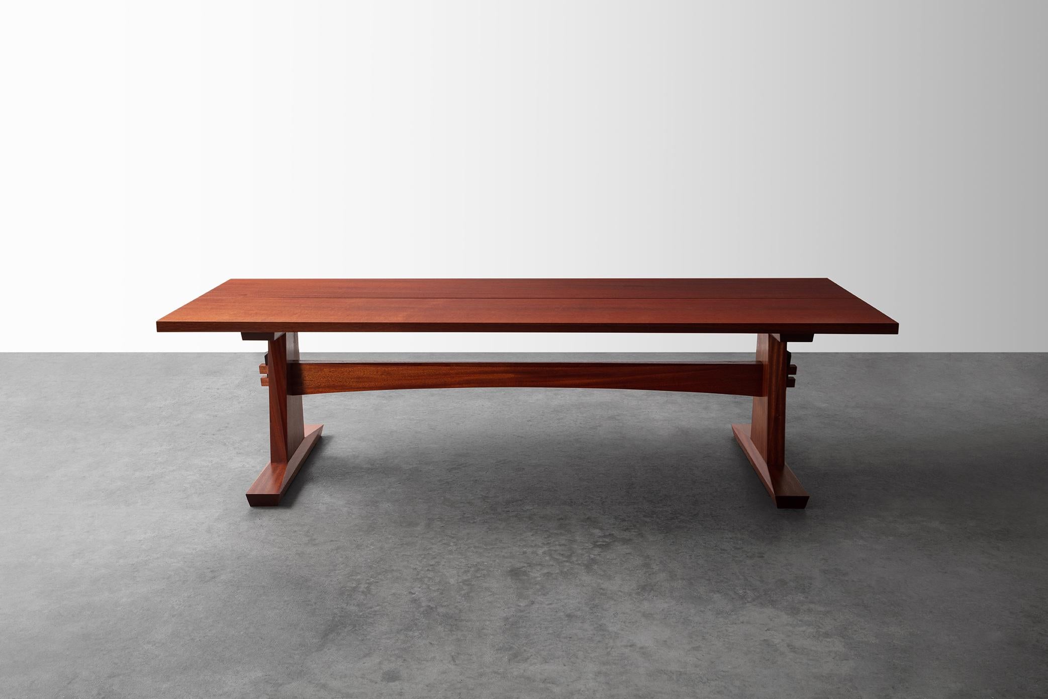 This striking Coffee Table, with it's trestle base and traditional joinery is unlike much of Richard's work. This piece, made of salvaged Sappelle, is both beautiful and sturdy. The hand-cut joinery of the trestle base is accentuated with a pair of