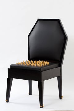 Contemporary Malicious Chair with Polished Brass Studs and Black Leather