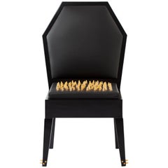 Contemporary Malicious Chair with Polished Brass Studs and Black Leather