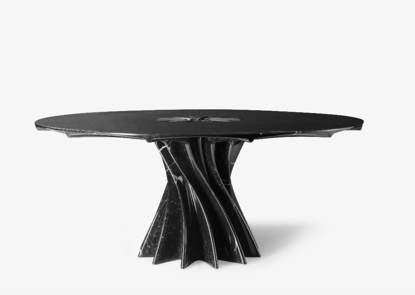 This contemporary polished marble table called the Vortex is designed in a limited edition of 12 by Arik Levy.
The table is a functional sculpture with a dominant presence that is inspired by the powerful energy of a vortex. 

The tabletop