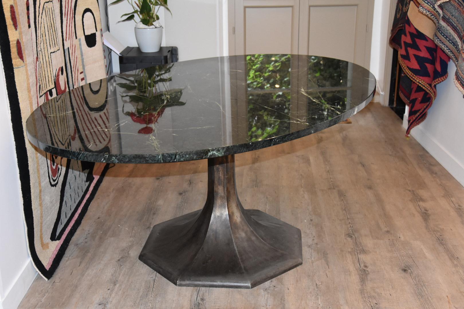 Unique, one of a kind dining table made of beautiful black marble and stainless steel, which was made by a famous French Ironworker. There is only one in the world because it was hand-crafted by the demand of Maison Tahissa.

