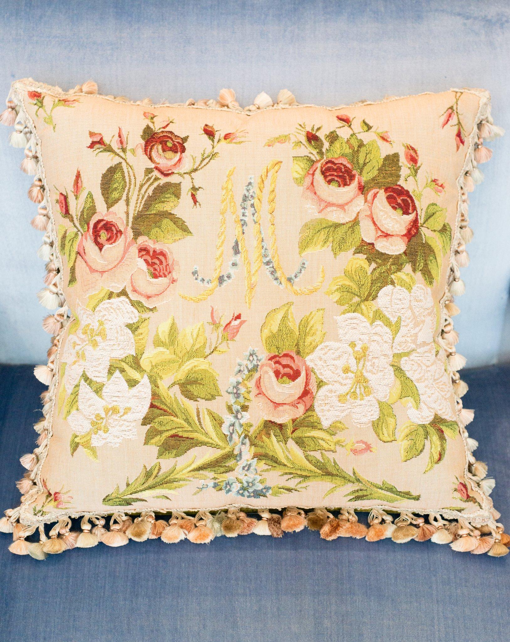 A Marie Antoinette tapestry pillow, backed with green velvet and silk fringe. Filled entirely with down and feather.