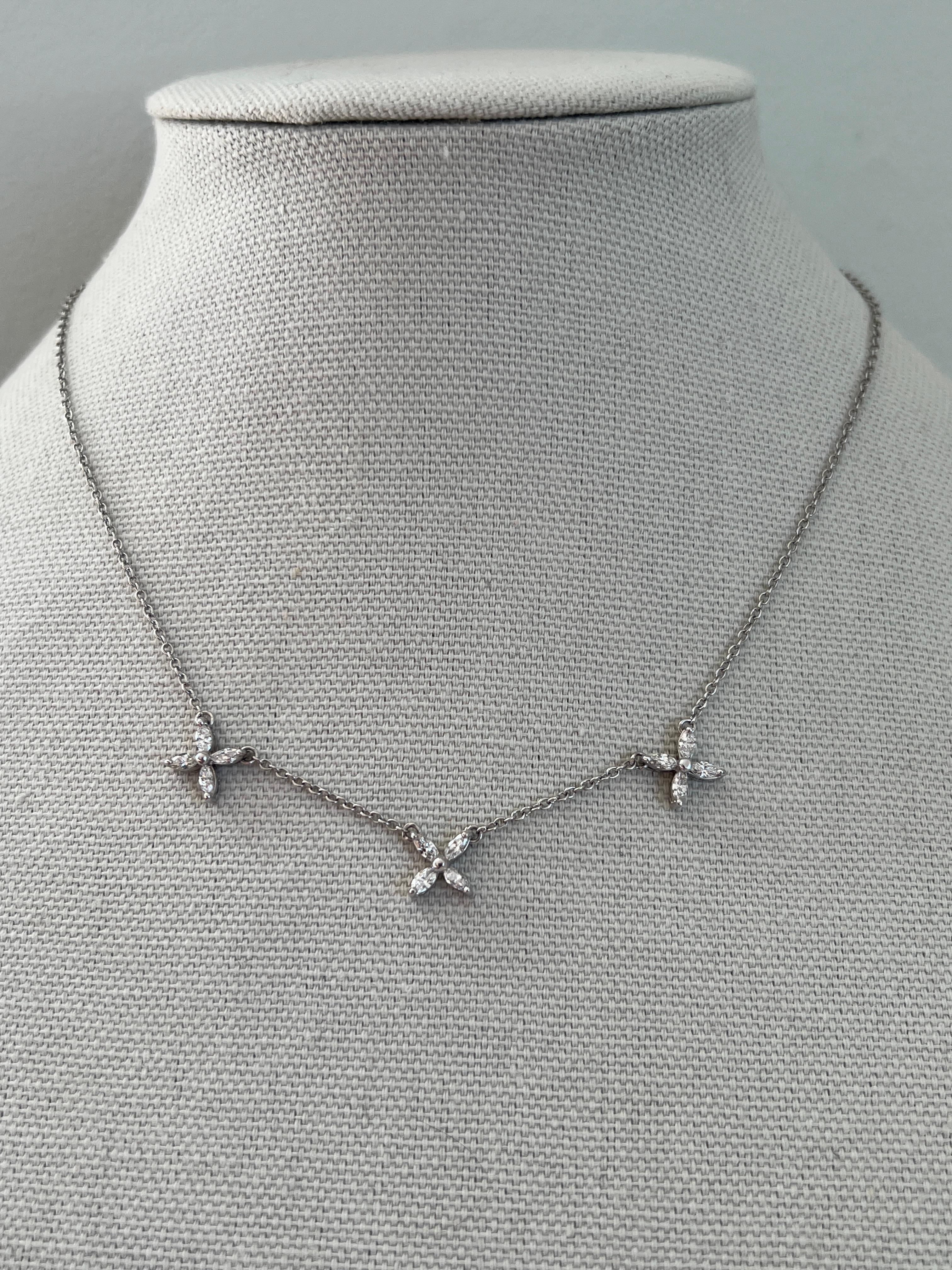 This contemporary 14 karat white gold station necklace features a refined cable chain adorned with three flower or star-shaped clusters, each crafted from twelve marquise-cut diamonds. The diamonds total approximately 0.50 carats, with H/I color and