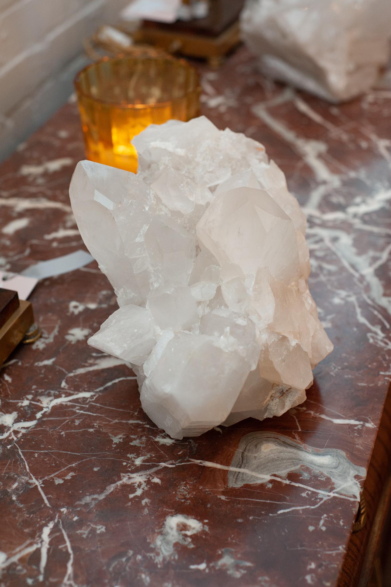 A massive contemporary rock crystal point cluster, weighing in over 18 pounds. Huge central crystal points are surrounded by smaller points in this one of a kind natural specimen. Rock crystal has long been used in decoration and many ornate pieces