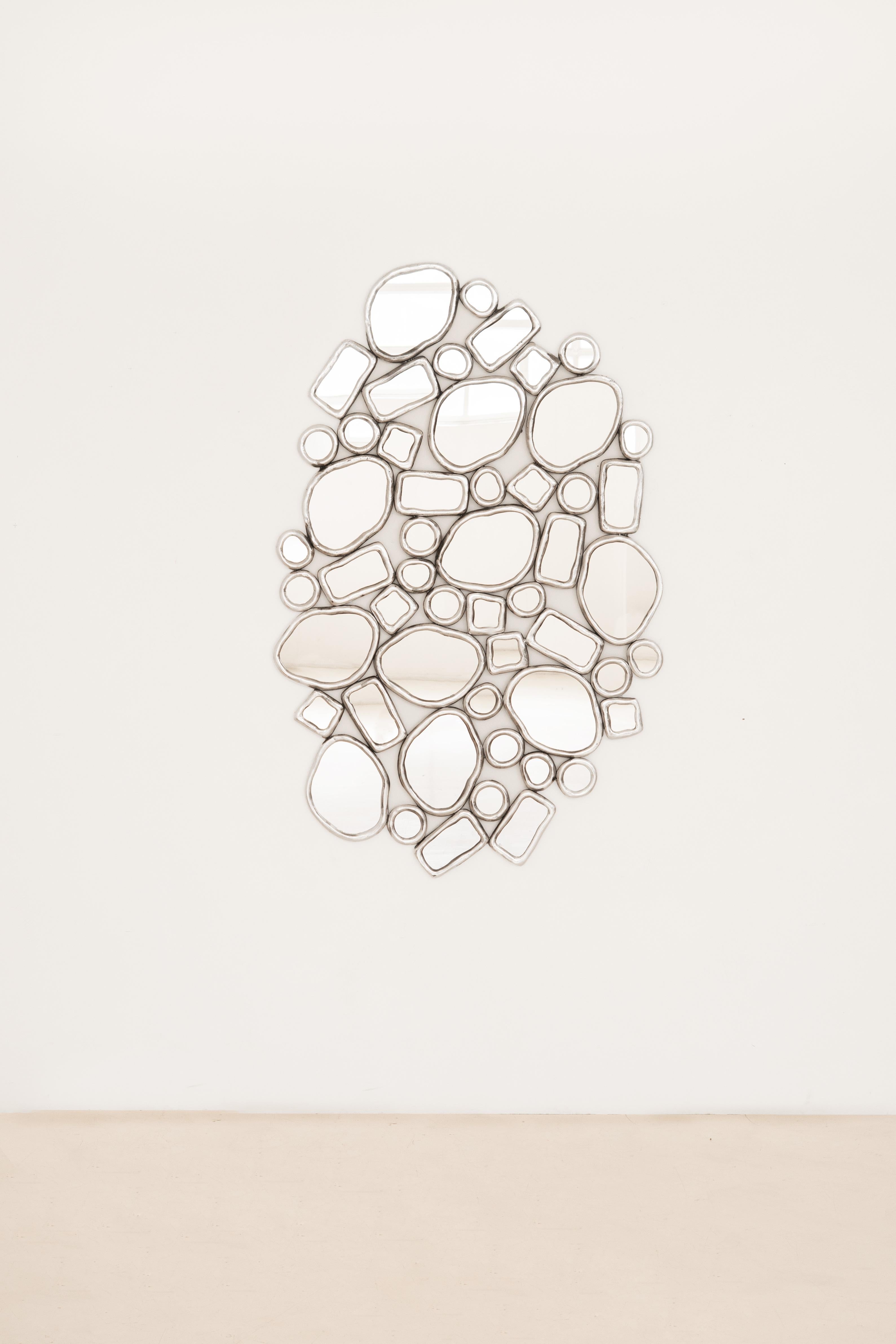 In the collection titled Material Distortion, Recchia reinterprets the historical practice of embedding glass in metal, a technique that dates back to the stained-glass traditions of the early Middle Ages and later found expression in decorative