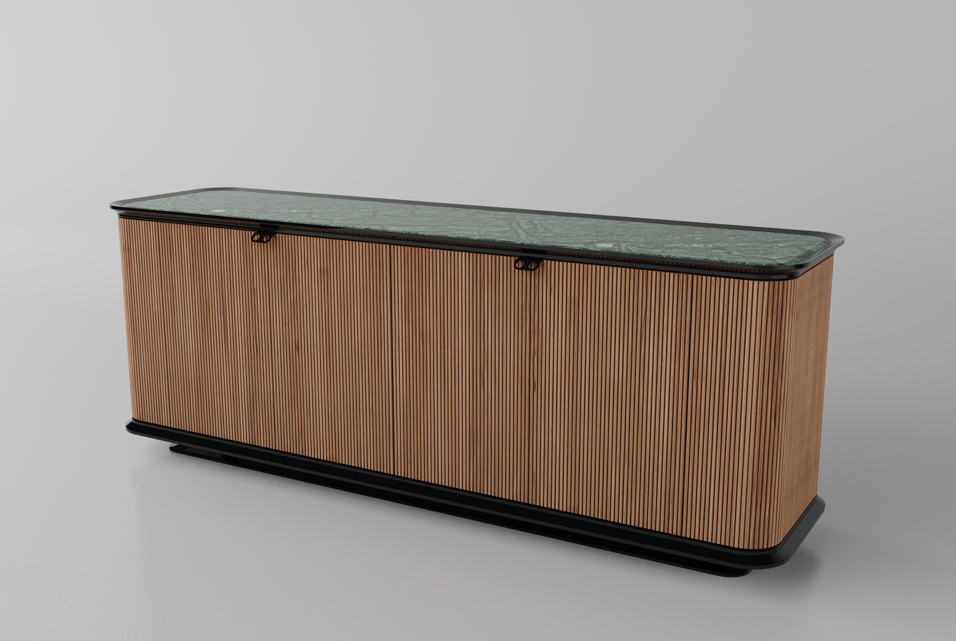 NEMESI #1 is a doble sided wooden sideboard, designed by SAGARÍA

The clean geometry and the authentic eloquence of the material, the solid Canaletto walnut doors mixed with the Calacatta gold marble, are the intrinsic feature that underlines the