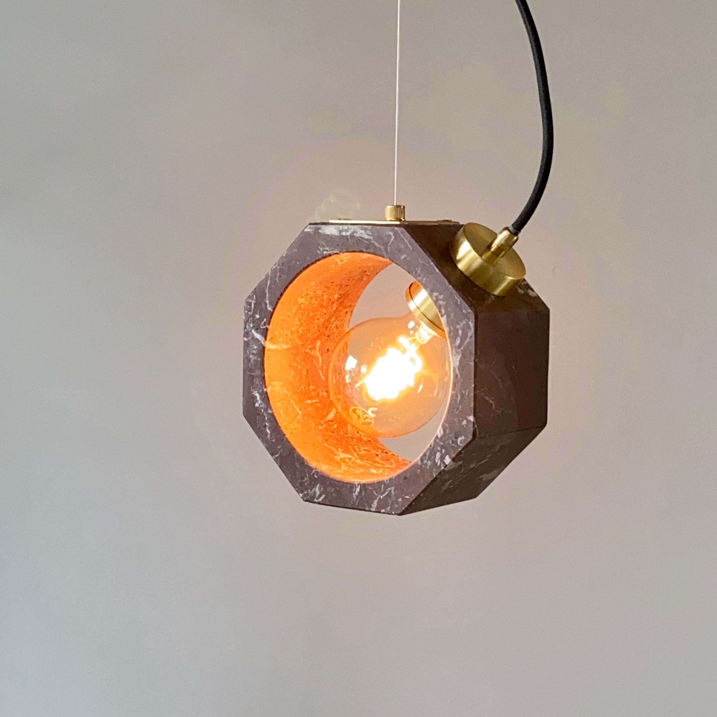 Cosulich interiors in collaboration with Matlight Studio: this pendant, part of the Italian Octagon collection, entirely handmade in Italy, has been developed keeping the essentiality as the core of the product, an organic monolithic block of red