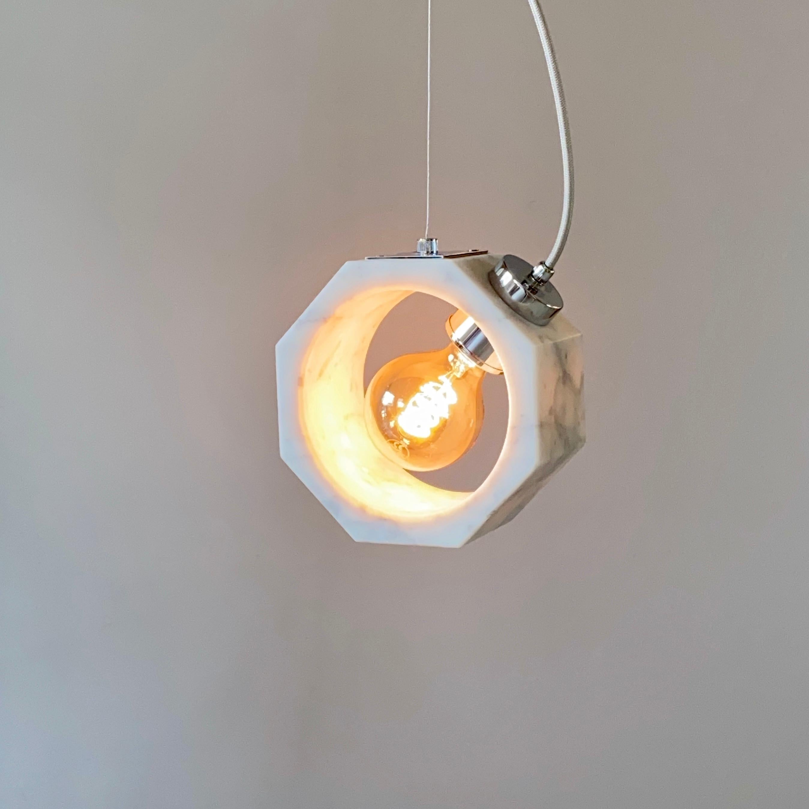 Cosulich interiors in collaboration with Matlight Studio: this pendant, part of the Italian Octagon collection, entirely handmade in Italy, has been developed keeping the essentiality as the core of the product, an organic monolithic block of white