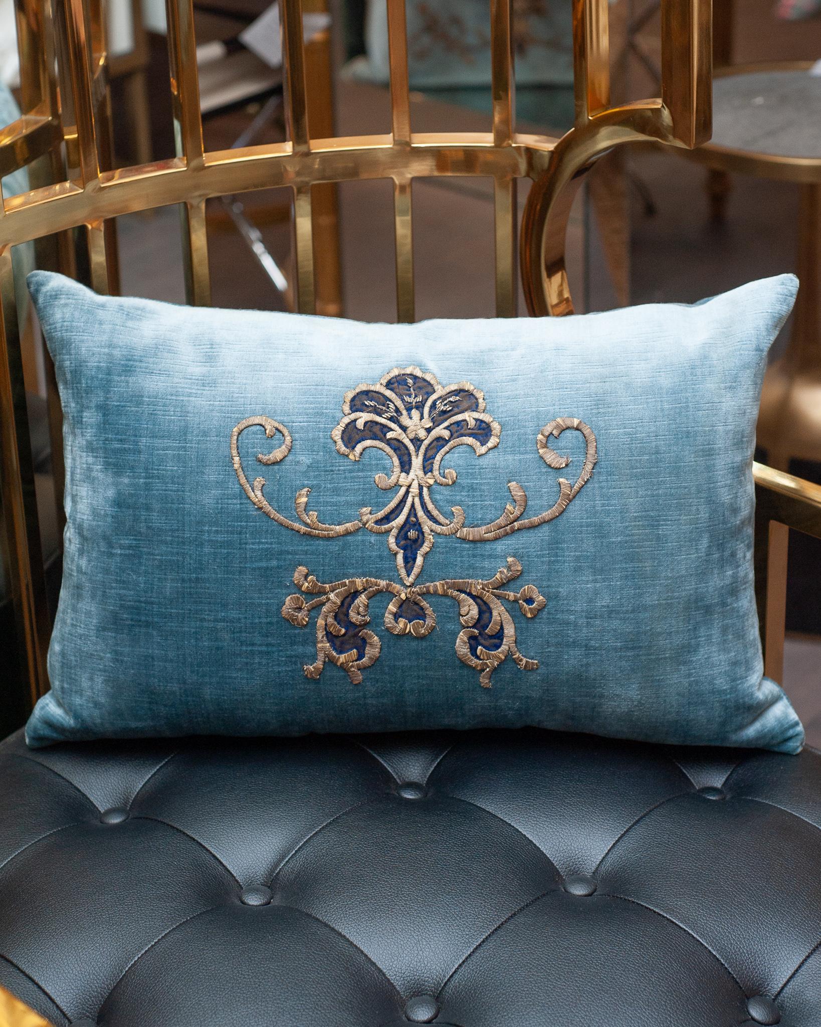 A stunning medium blue velvet pillow with hand-stitched Antique Ottoman metallic embroidery. Filled with a down and feather insert for a pillow that is as soft and luxurious as it is beautiful.