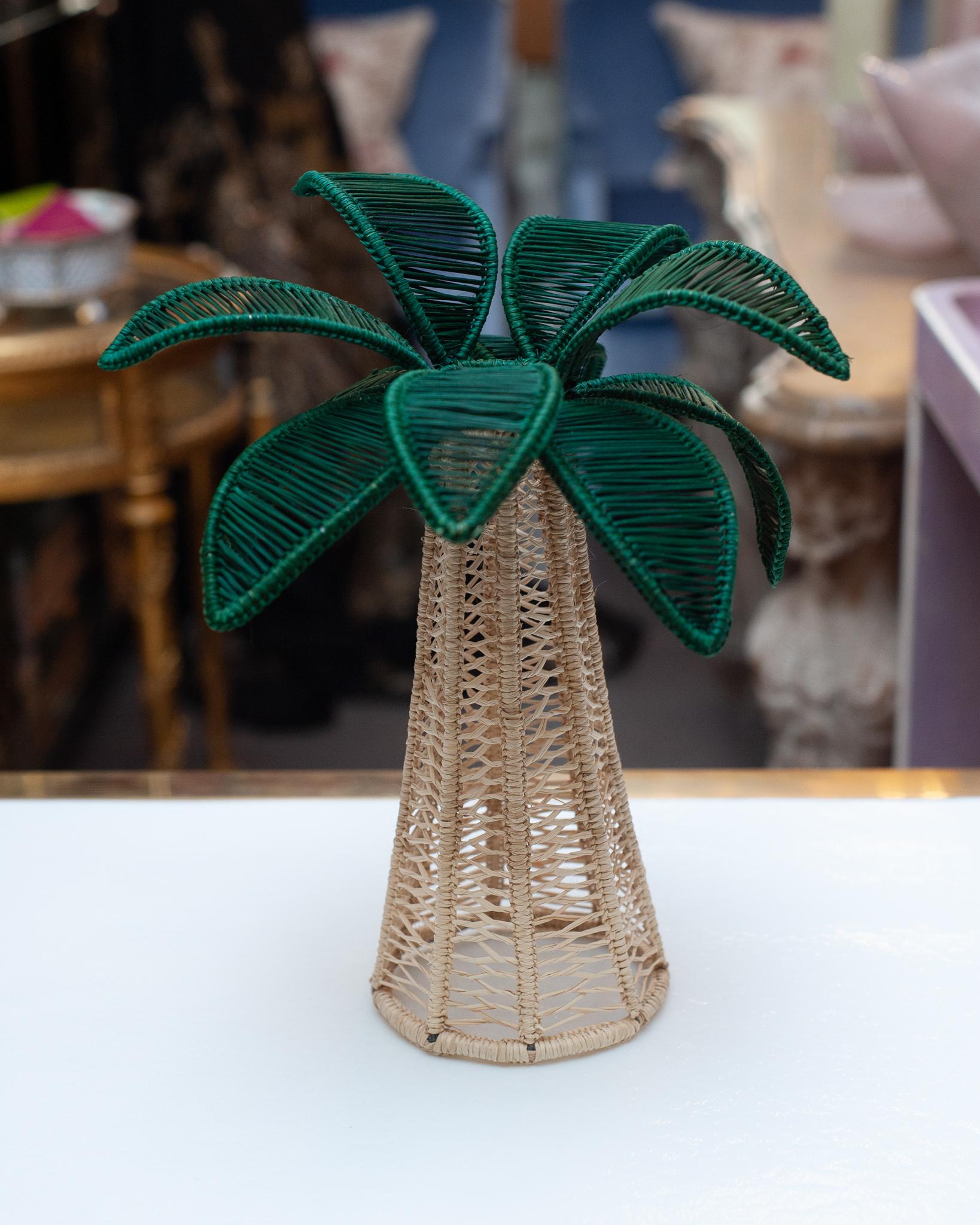 A beautiful hand woven rattan palm tree is a perfect decoration for a table or console. Finely crafted by expert artisans, these pieces all showcase the classical technique of weaving in a modern way. From Jean Michel Frank to the House of Dior,