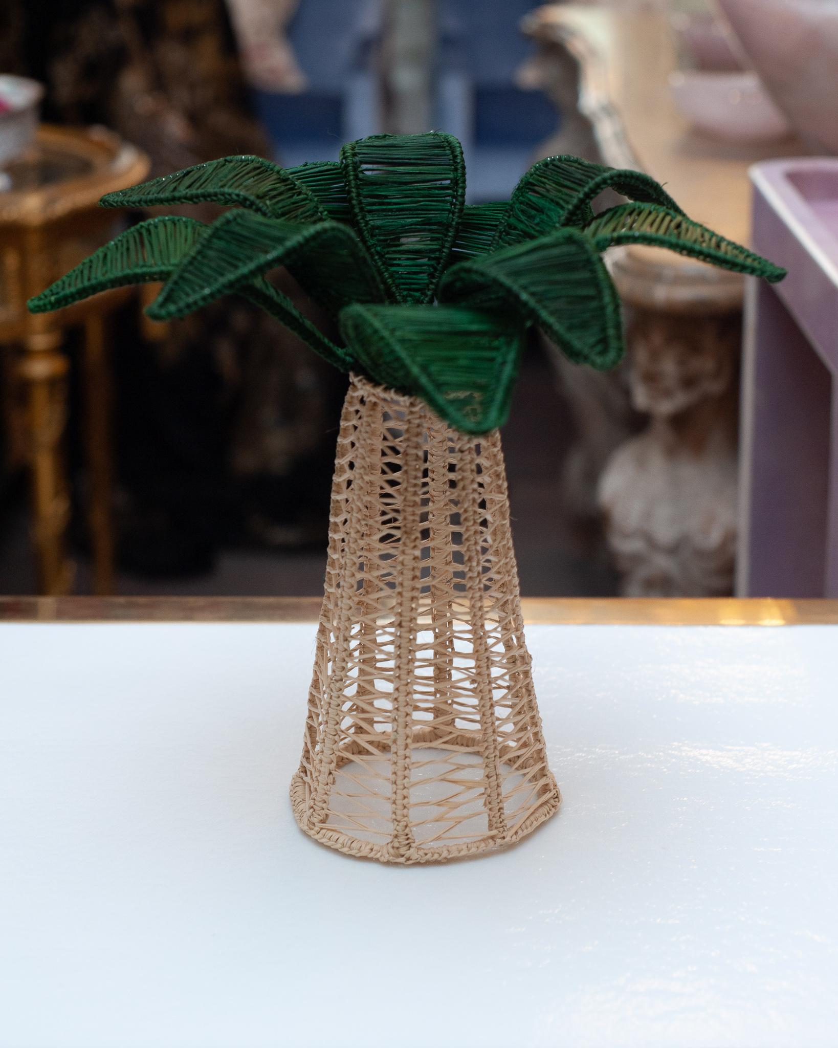 A beautiful hand woven rattan palm tree is a perfect decoration for a table or console. Finely crafted by expert artisans, these pieces all showcase the classical technique of weaving in a modern way. From Jean Michel Frank to the House of Dior,