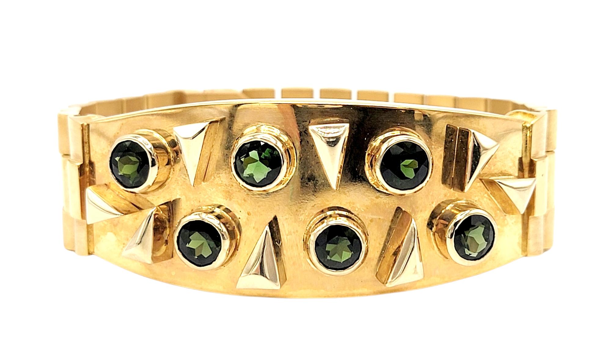 This eye-catching men's green tourmaline and 18 karat yellow gold watch link bracelet makes a bold and luxurious statement. The contemporary design of this impressive piece looks handsome on the wrist, really drawing the viewers attention to the