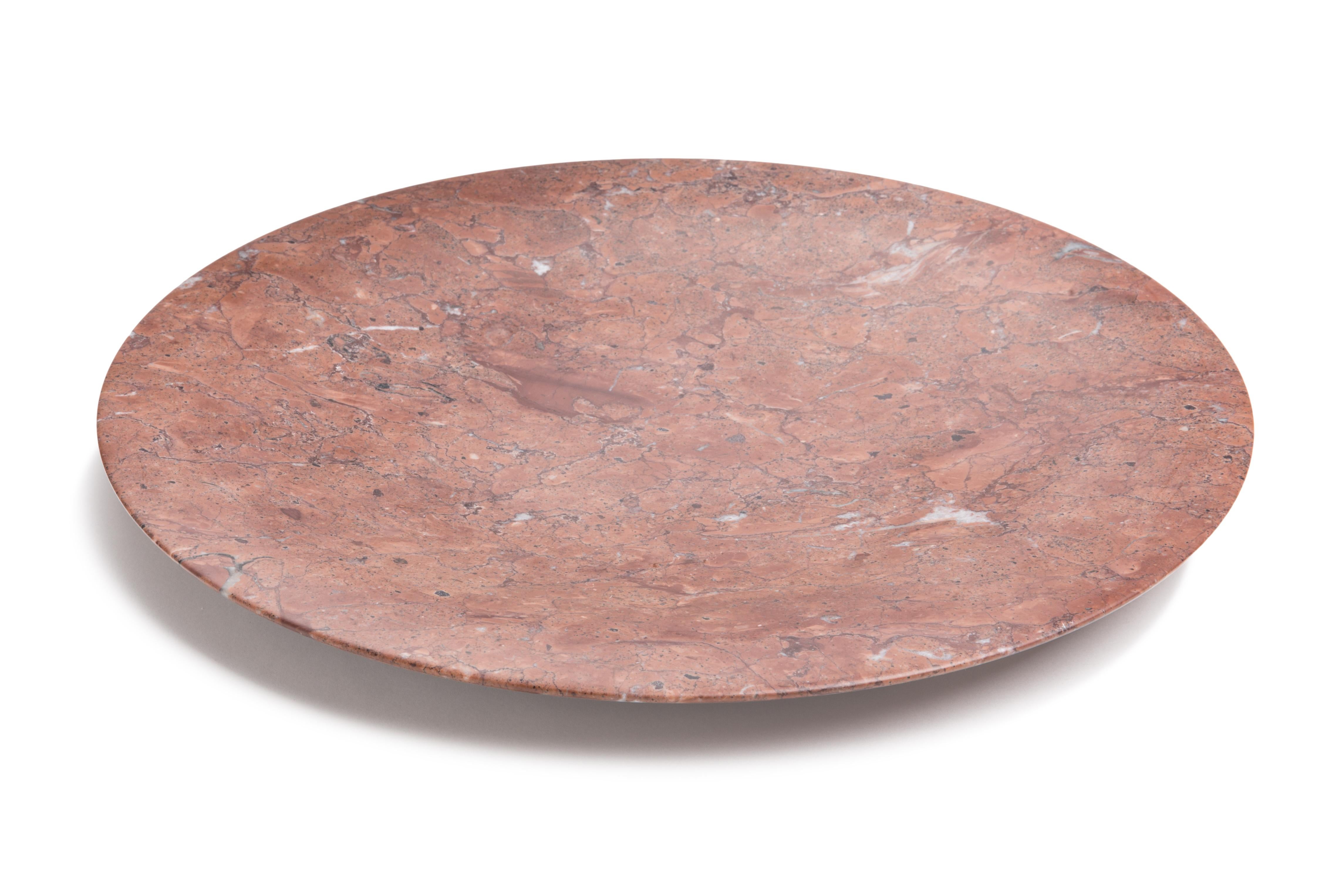 This stunning tray, made from Mexico Red marble, evokes the Renaissance concept of man being at the centre of space and nature with its circular shape. The circle is rich in symbolism in European history and art. The fusion of these two elements of