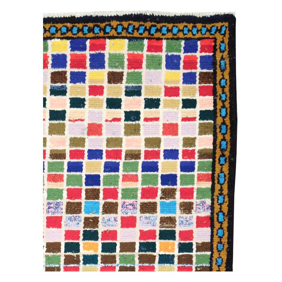 A vintage Persian Hamadan throw rug handmade during the mid-20th century with a modern and colorful checkered pattern.

Measures: 3' 4
