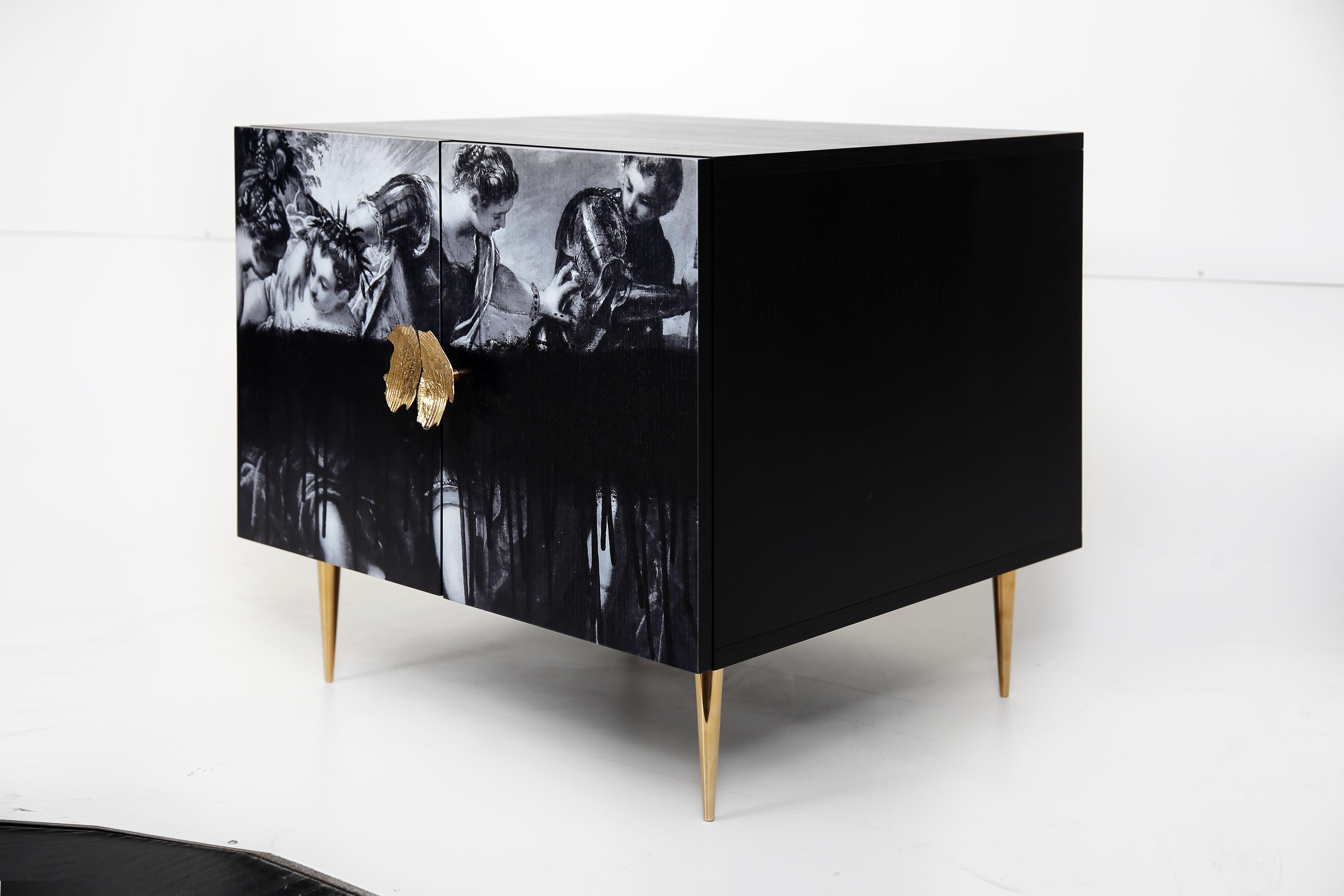 Be the envy of friends and family with the Modern Minerva buffet. Its sleek black finish and printed artwork on the front will fit comfortably in any size room while its spacious two cupboards with one shelve provide ample storage for all your