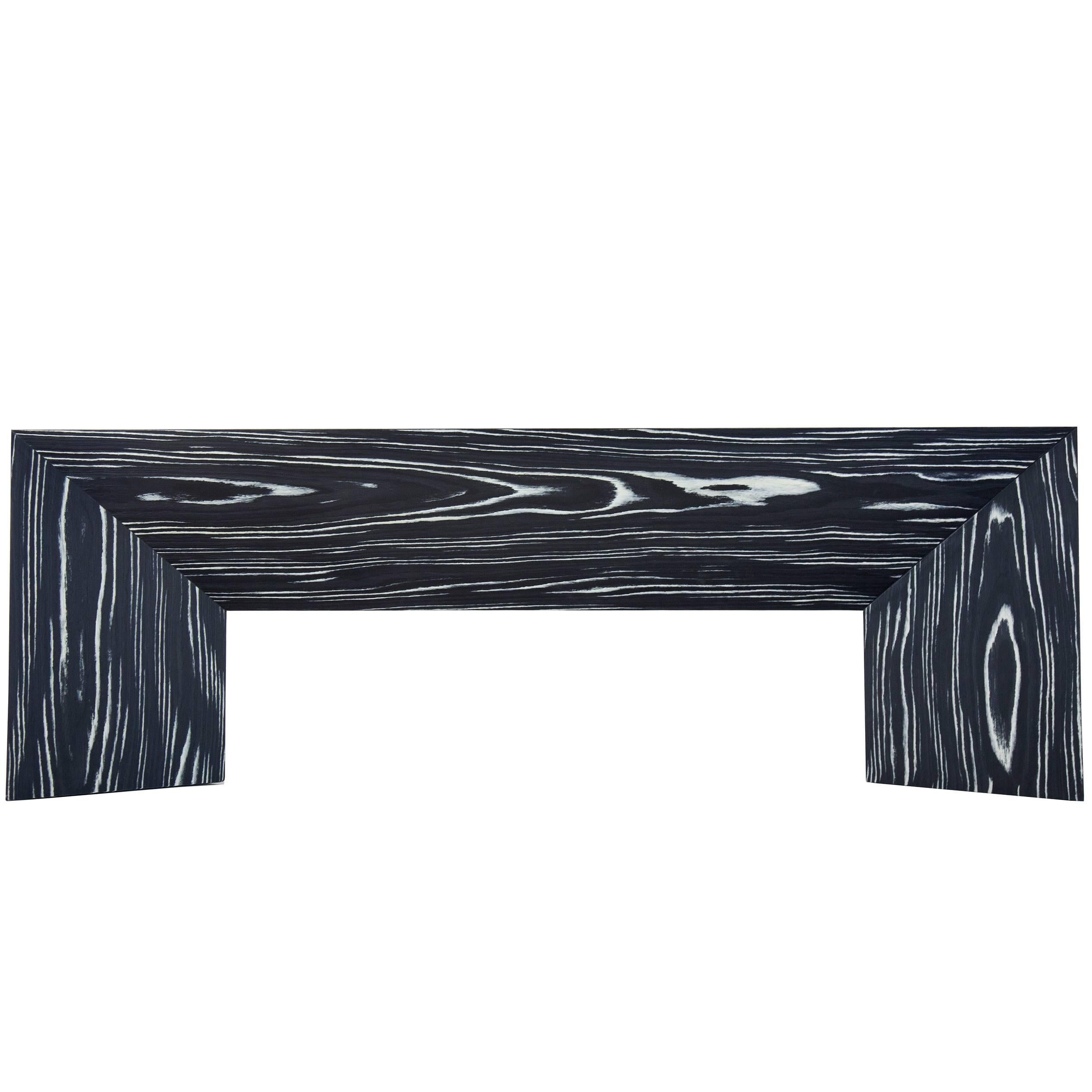 Perfect for a foyer or the end of a bed, the contemporary minimal lined, black and white, Fold Bench is easily adapted to any space. The Fold Bench began as an experiment in creating a 3D object from a two dimensional plane of paper. This