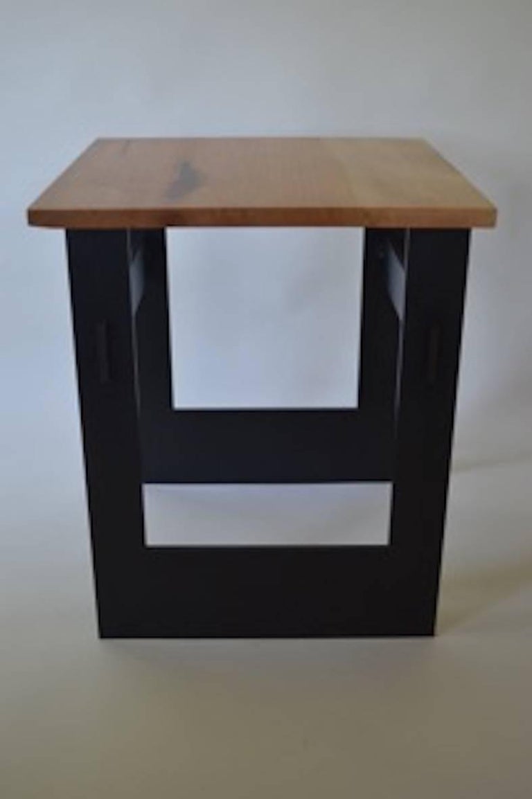 The Interlocking Side Table, an original design offered exclusively by Vermontica, is a contemporary Minimalist blackened steel and wood side table designed and produced in Vermont by Scott Gordon. The base is from a 3/8