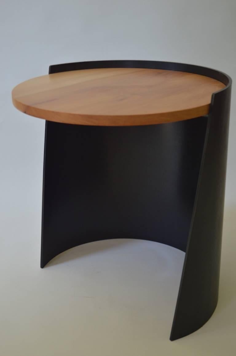 The Cylindrical Side Table, an original design offered exclusively by Vermontica, is a contemporary Minimalist blackened steel and wood side Table designed and produced in Vermont by Scott Gordon. The base is cut from a 1/4
