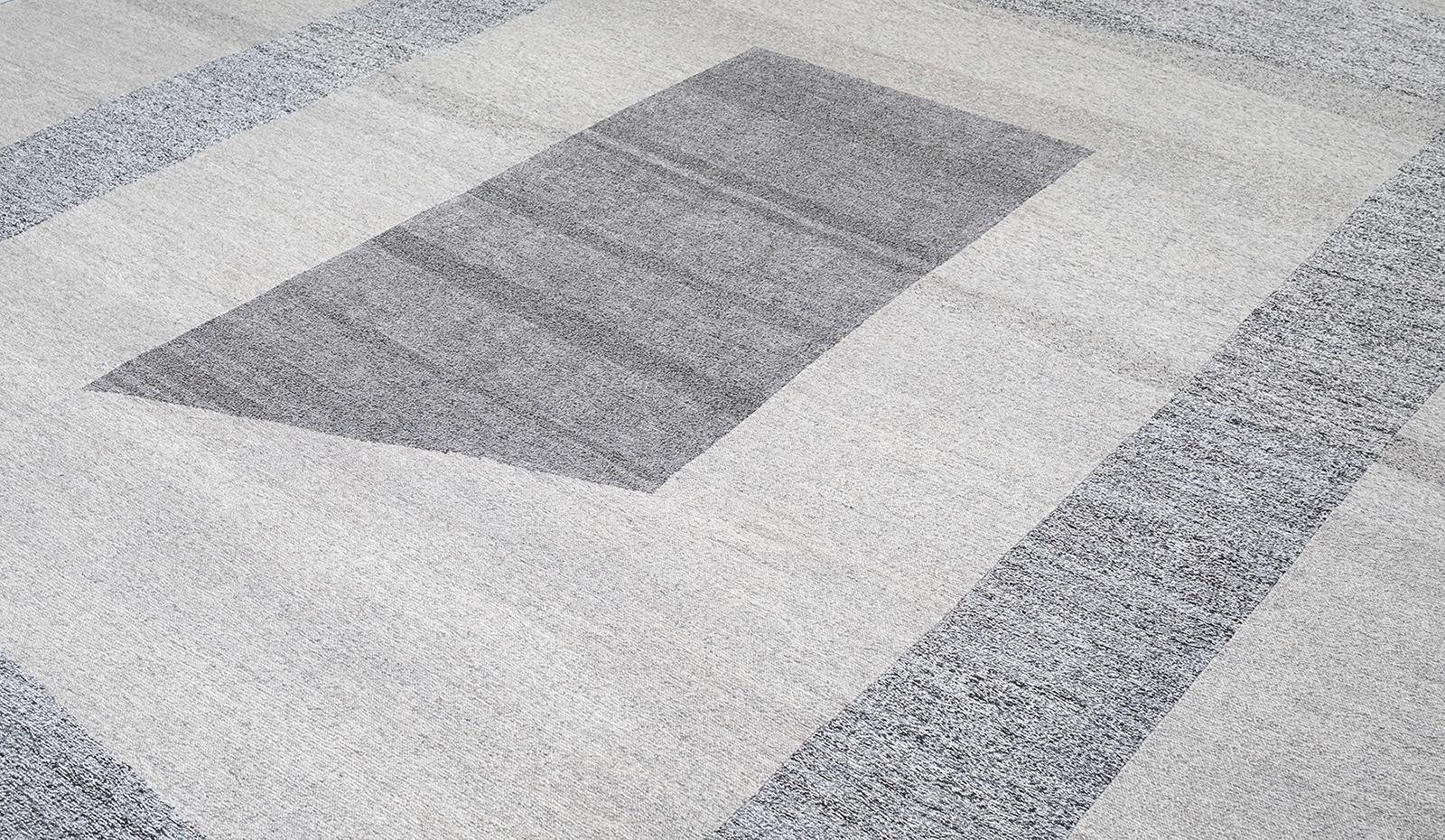 This Pelas rug titled, Sonic, is a flatweave made with handspun wool and natural dyes. It is inspired by the antique kilims that are native to the Kurdish region in Iran. Nasiri continues their rich tradition of rug making by applying the same