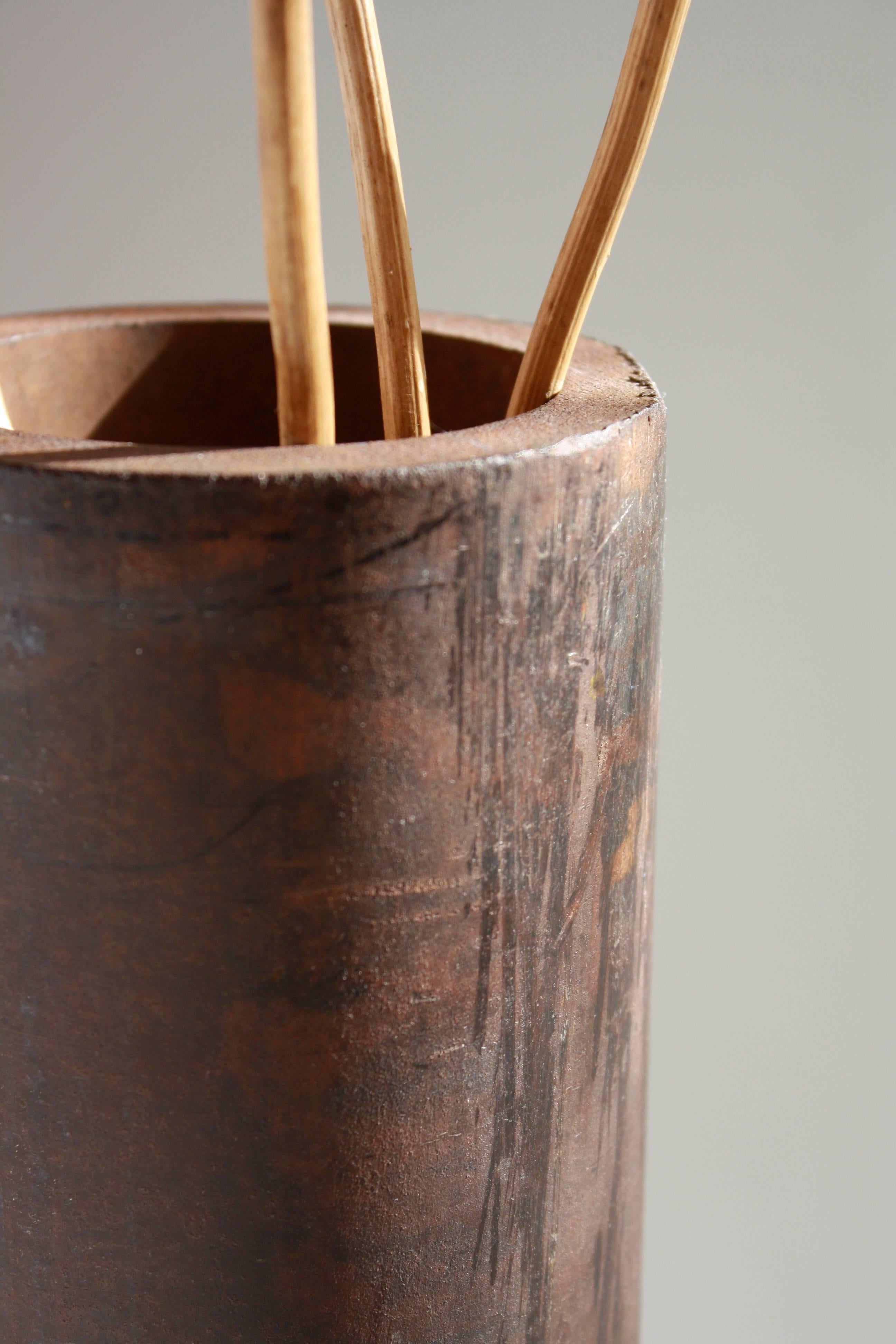 The DOM vase, an original design offered exclusively by Vermontica, is a Contemporary Minimalist patinated steel vase designed and produced in Vermont by Scott Gordon. The vase measures 4