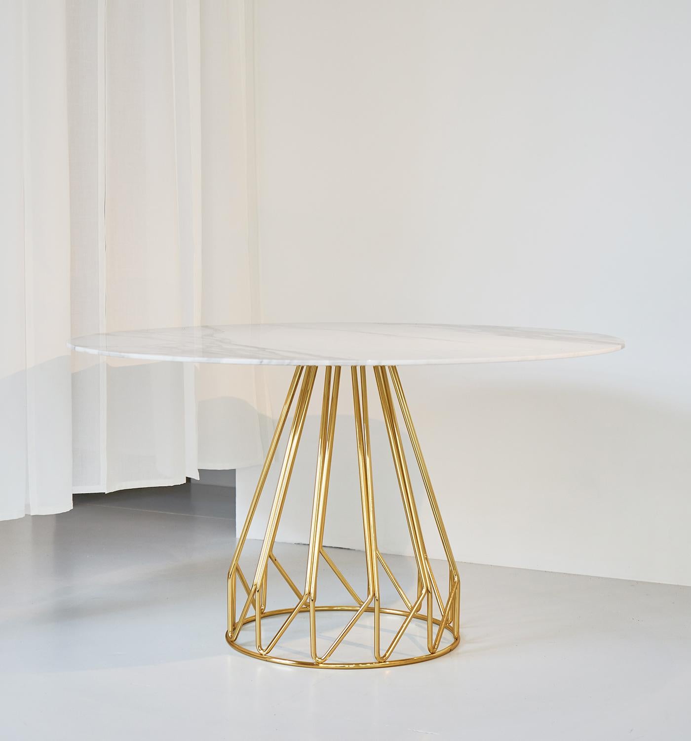 An harmonic sequence of metal wires folded in here, each element is part of a large, light and structured whole whit Arabescato Caldo Marble top diameter of 1300
Madama table is available with many different marble and glass top.
Madama table,