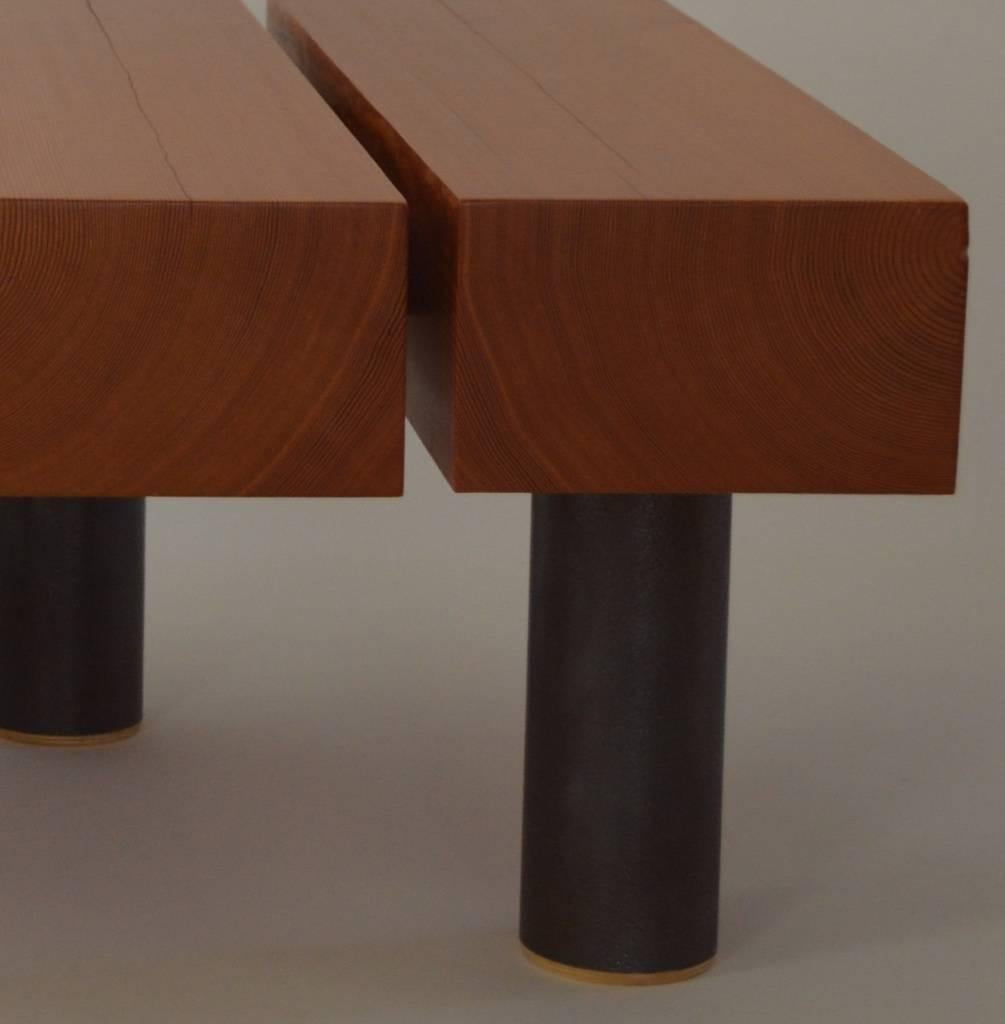 The Cantilevered Coffee Table, designed by Scott Gordon and handmade in Vermont, features solid Douglas fir beams suspended over offset patinated steel legs. The floating effect of the wood elements gives the piece a striking sense of movement and
