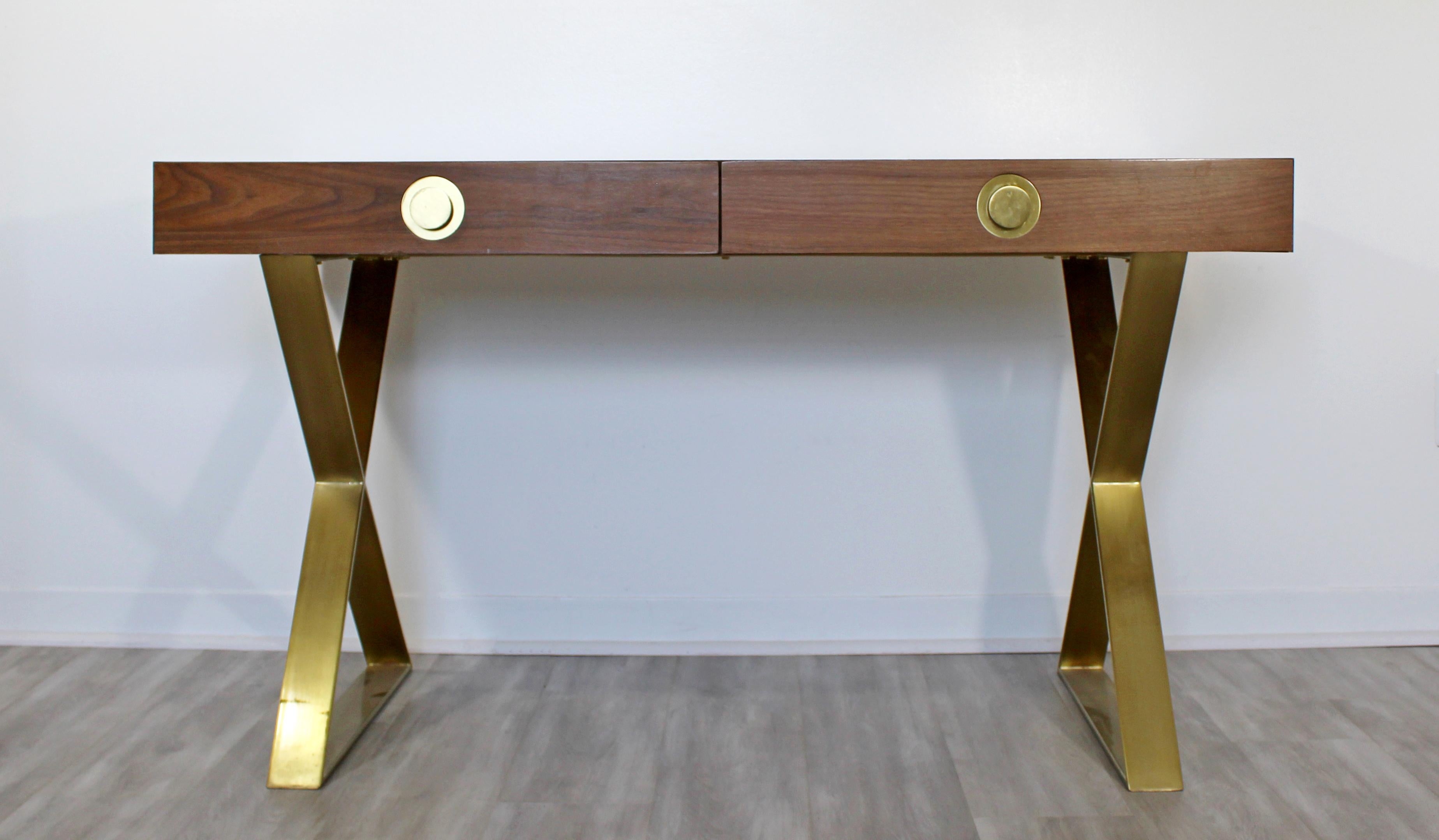 For your consideration is a beautiful, campaign desk, on brass X bases and with brass pulls, by Jonathan Adler, in the style of Milo Baughman. In good condition. The dimensions are 54