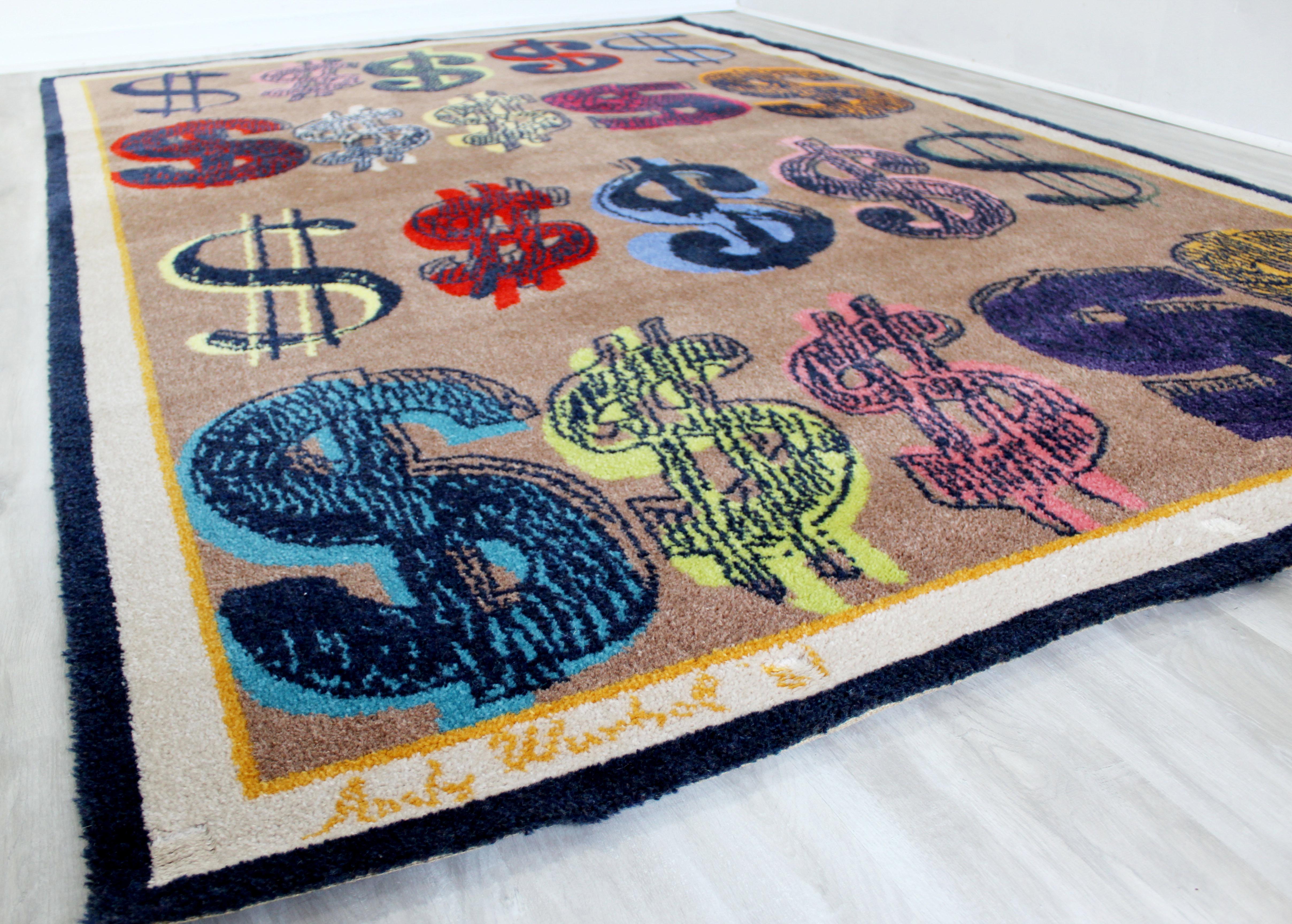 For your consideration is an incredible area rug or carpet, with a dollar sign design, signed by Andy Warhol, circa 1981. In excellent condition. The dimensions are 110