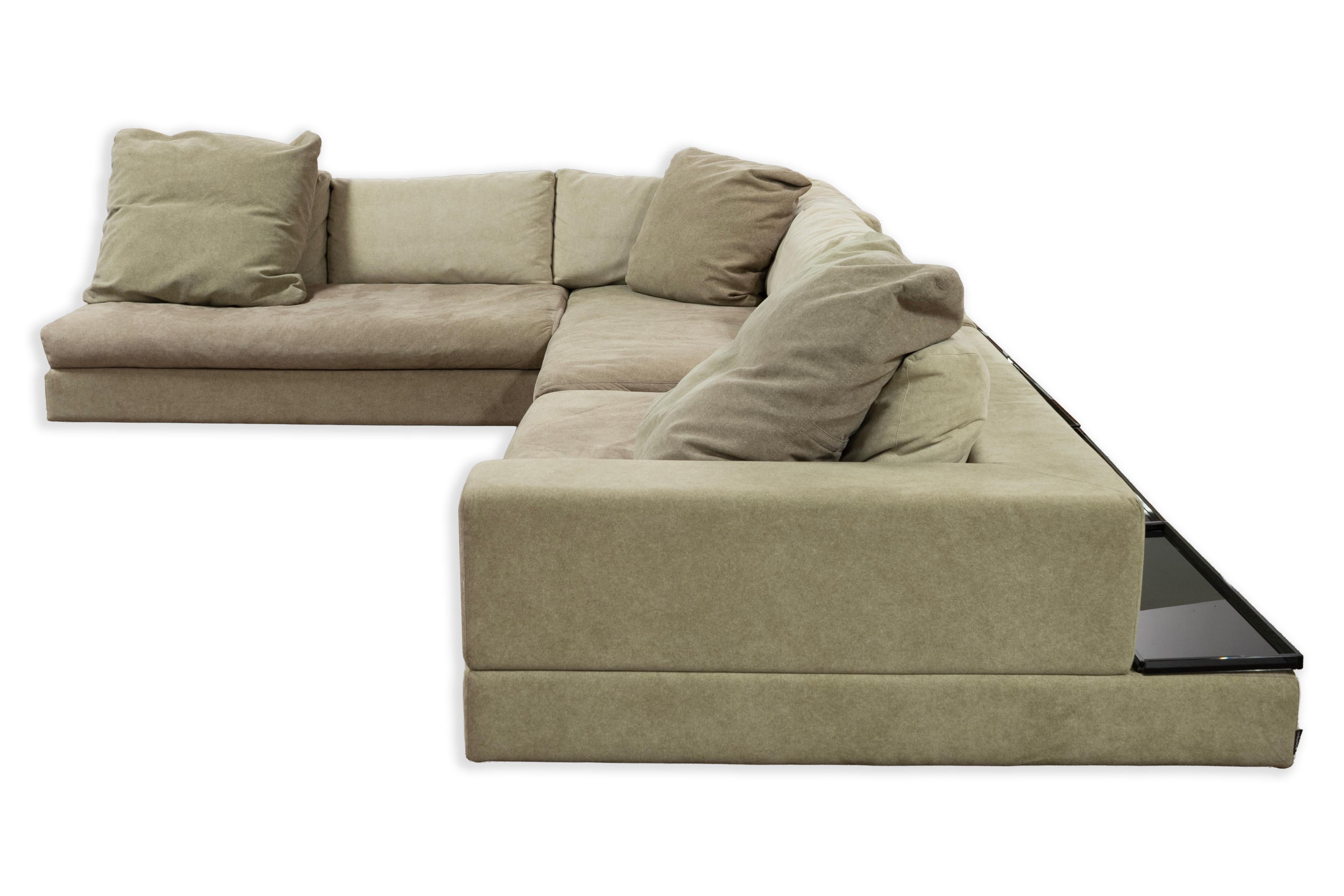 This spacious and stylish sectional sofa by Arketipo was crafted in Italy during the 1990s. It features a three-piece L-shaped design with generous proportions, plush cushions, and a low-profile silhouette typical of contemporary Italian style.