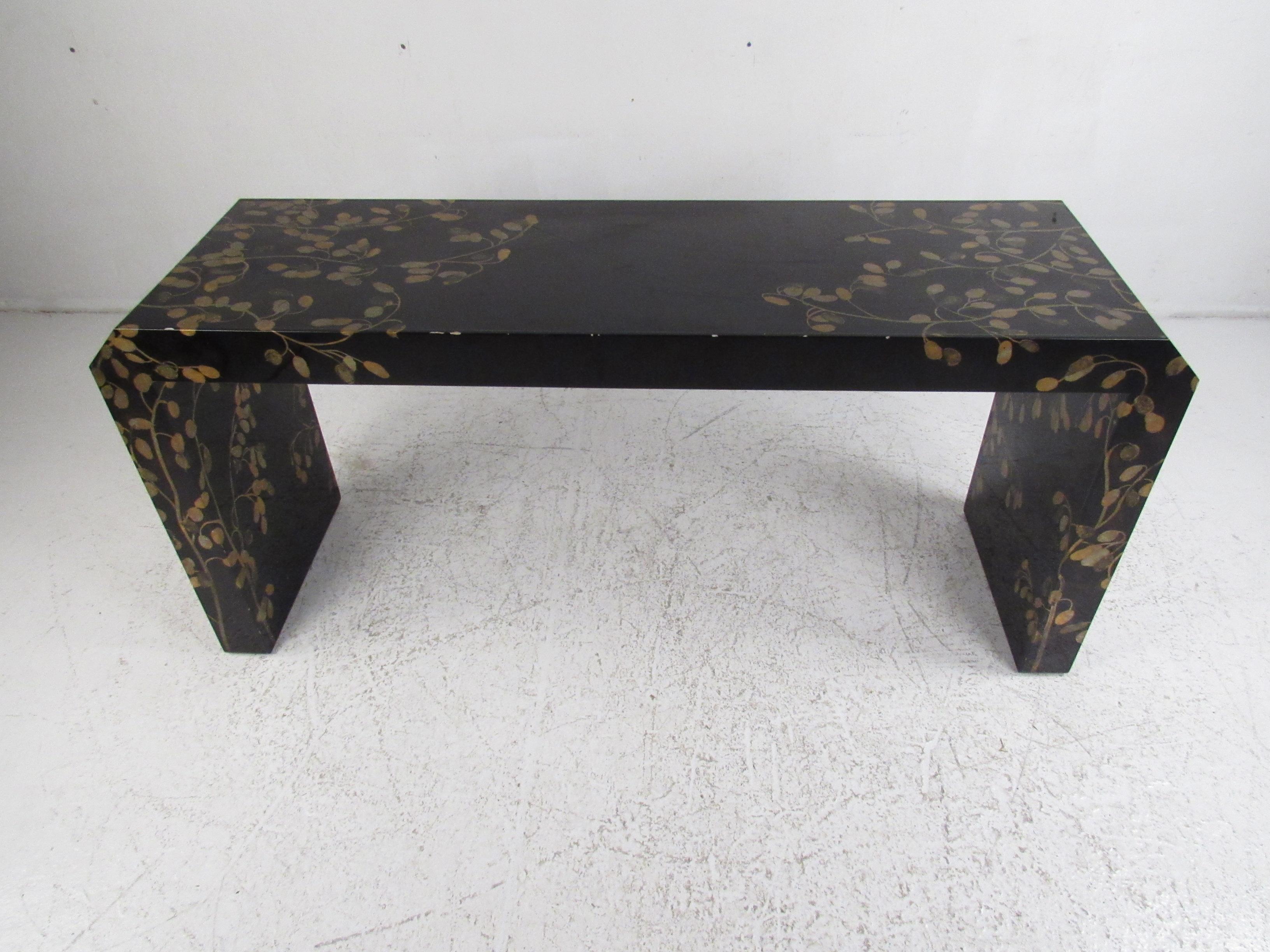 An impressive midcentury style console table with lovely floral artwork painted underneath a clear lacquer finish. This Asian style waterfall hall table looks great in the entryway, hallway, or even behind the sofa. Please confirm item location (NY