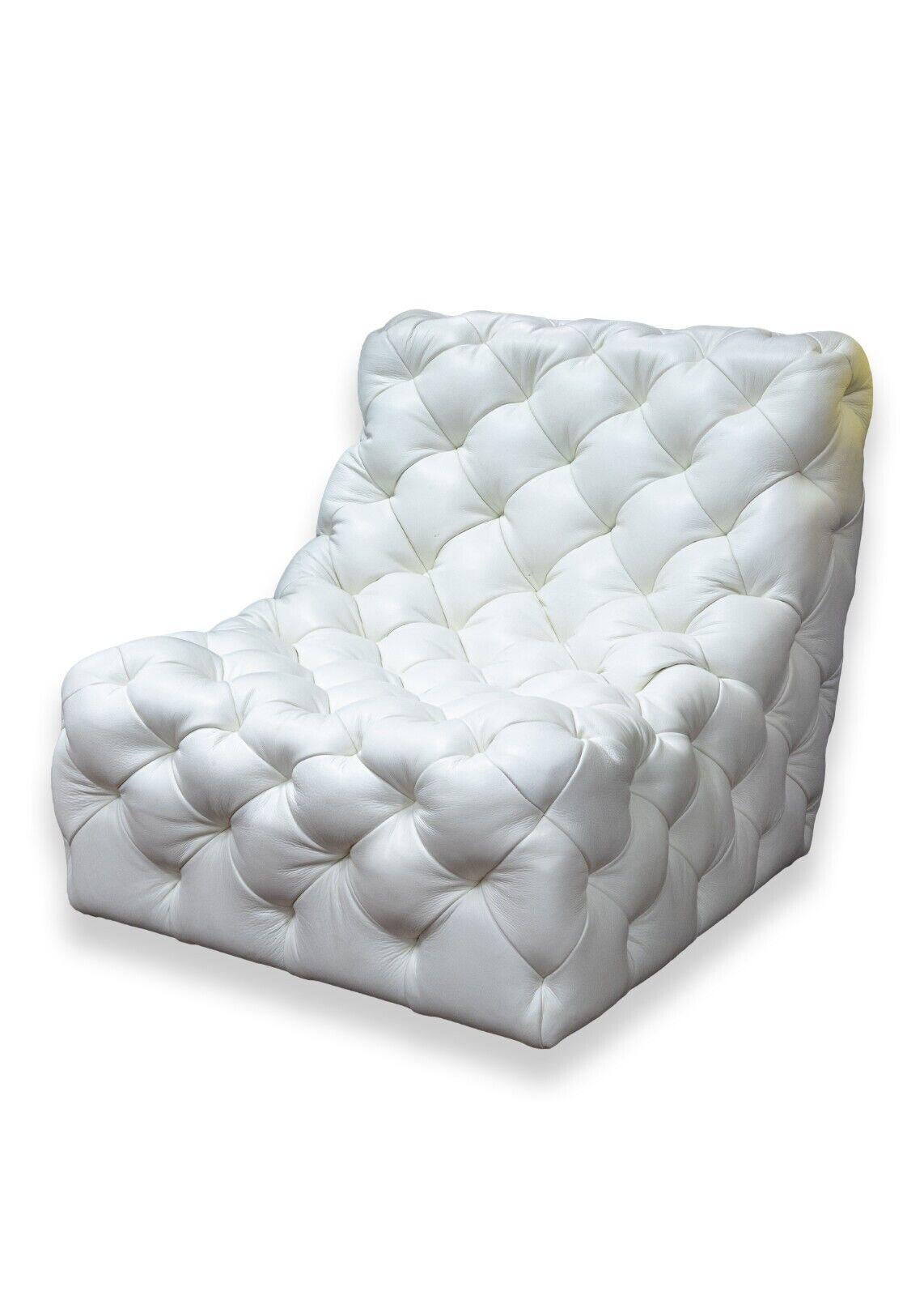 A contemporary modern Bernhardt Rigby white tufted leather swivel accent lounge chair. This is an extremely fun piece of furniture with a beautiful design. This chair features a gorgeous soft, white tufted leather from head to toe, and a smooth