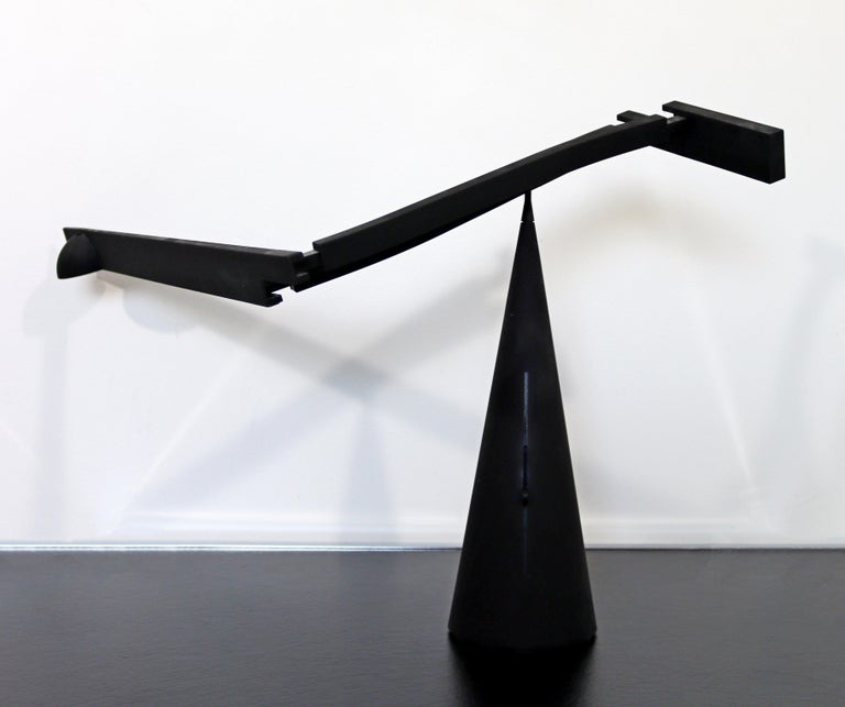 For your consideration is a magnificent, matte black, adjustable table lamp by Mario Barbaglia and Marco Colombo 