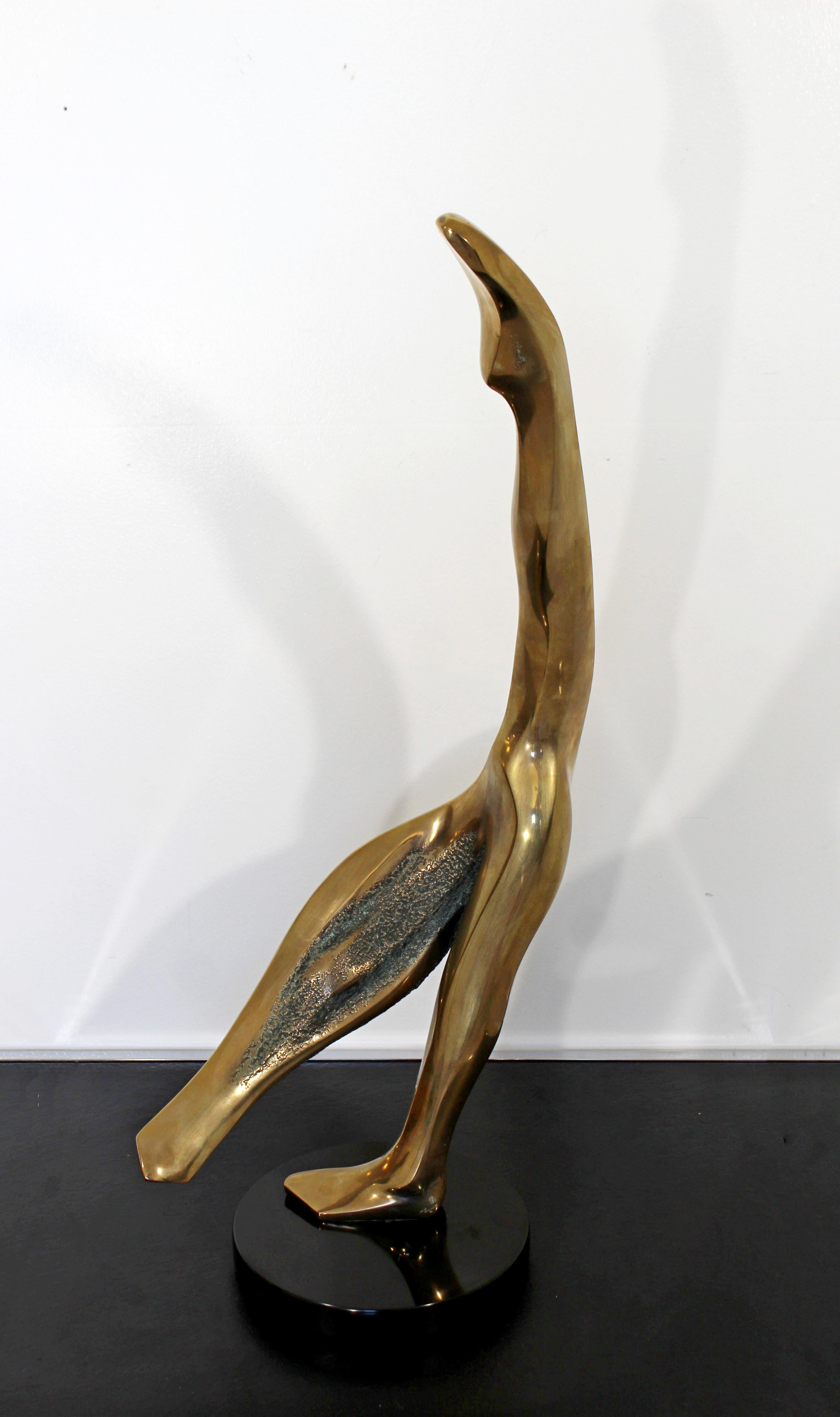 For your consideration is a magnificent, abstracted, bronze ballerina table sculpture, signed dated and numbered, in two places, by Bob Bennett, 25/150, circa 1981. In excellent condition. The dimensions are 12