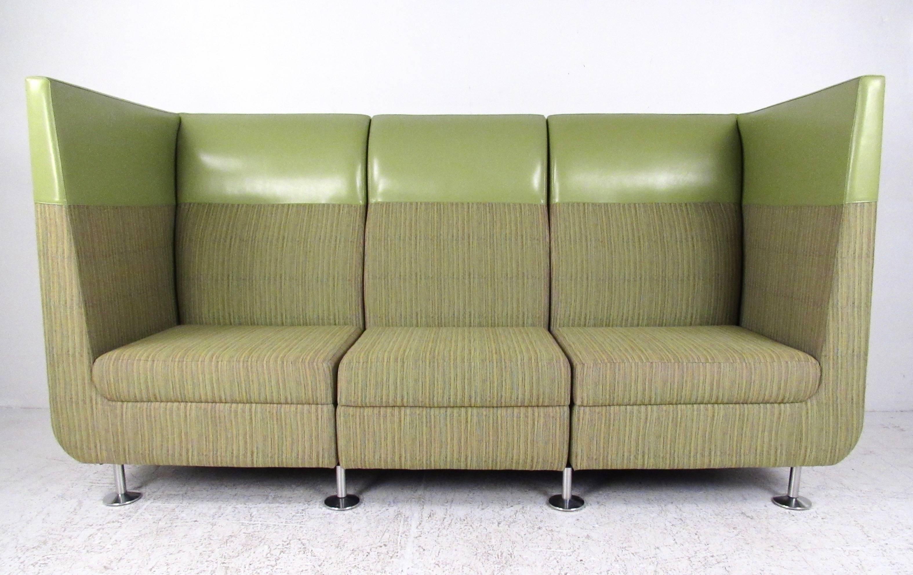 This unique modern sofa features three-seat sectional design in a mixed green covering. Chrome finish legs and clean modern lines add to the appeal of this restaurant booth like sofa. Large contemporary sofa makes a striking seating addition to