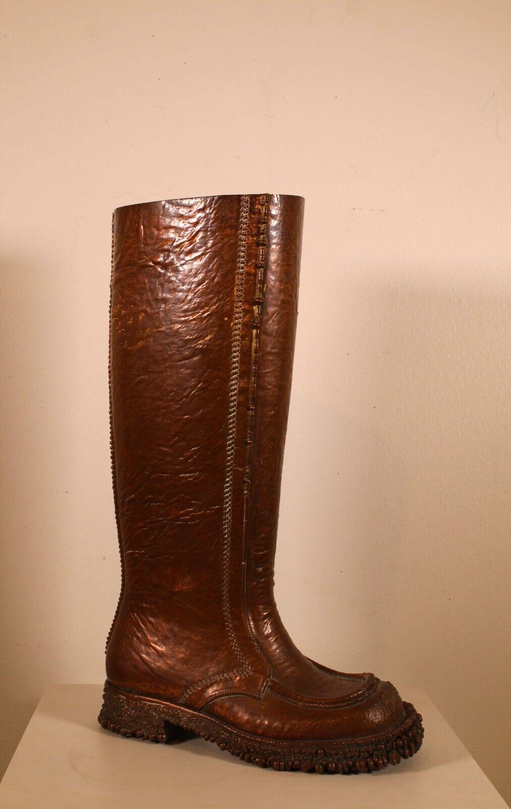 This unique bronzed casted boot up for consideration. Can be used as an umbrella or cane holder. In very good condition. Dimensions: 4