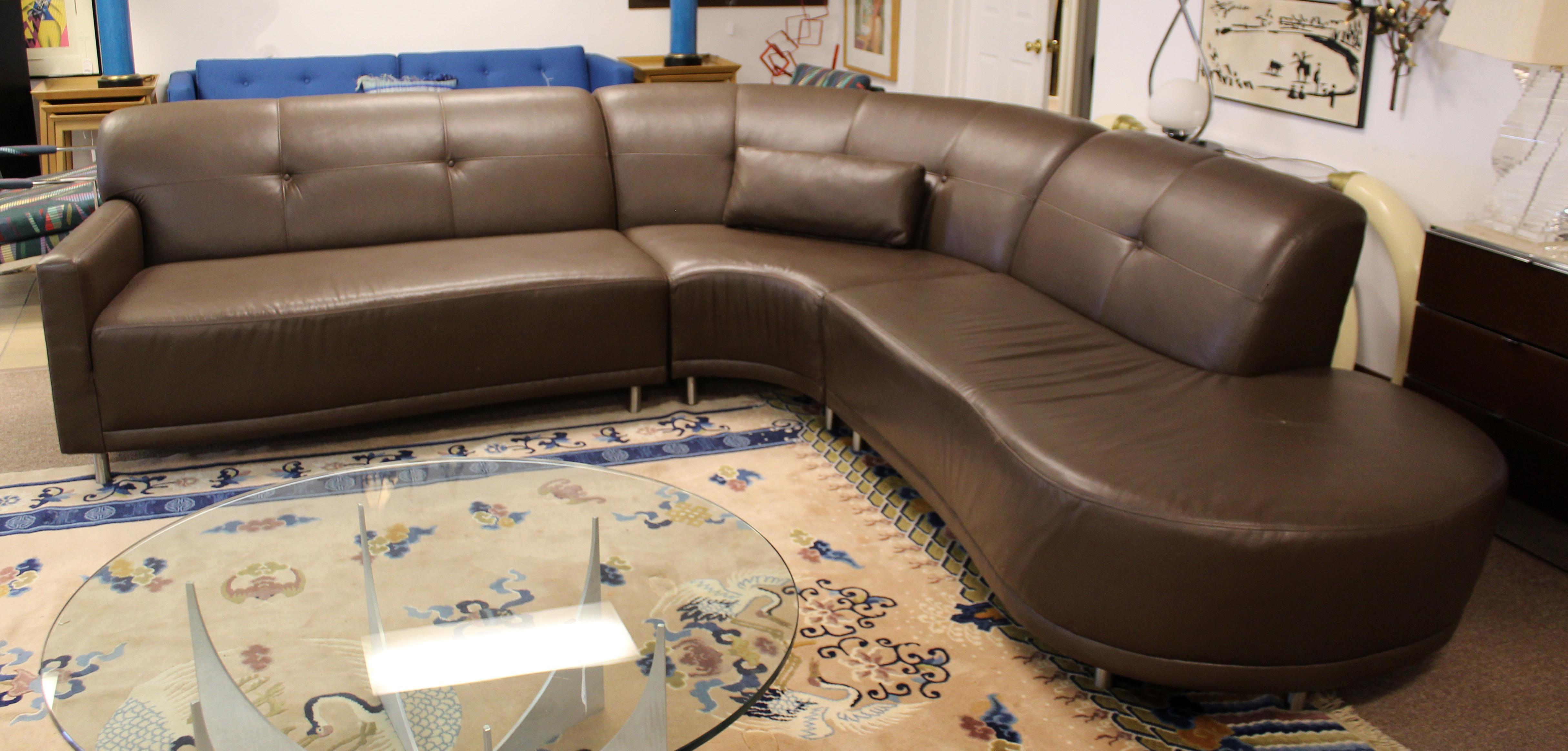 For your consideration is a phenomenal, three piece, curved sectional sofa, with a creamy brown leather upholstery that feels like butter, by Carsons, circa 2004. In excellent condition. The dimensions of each piece are 58
