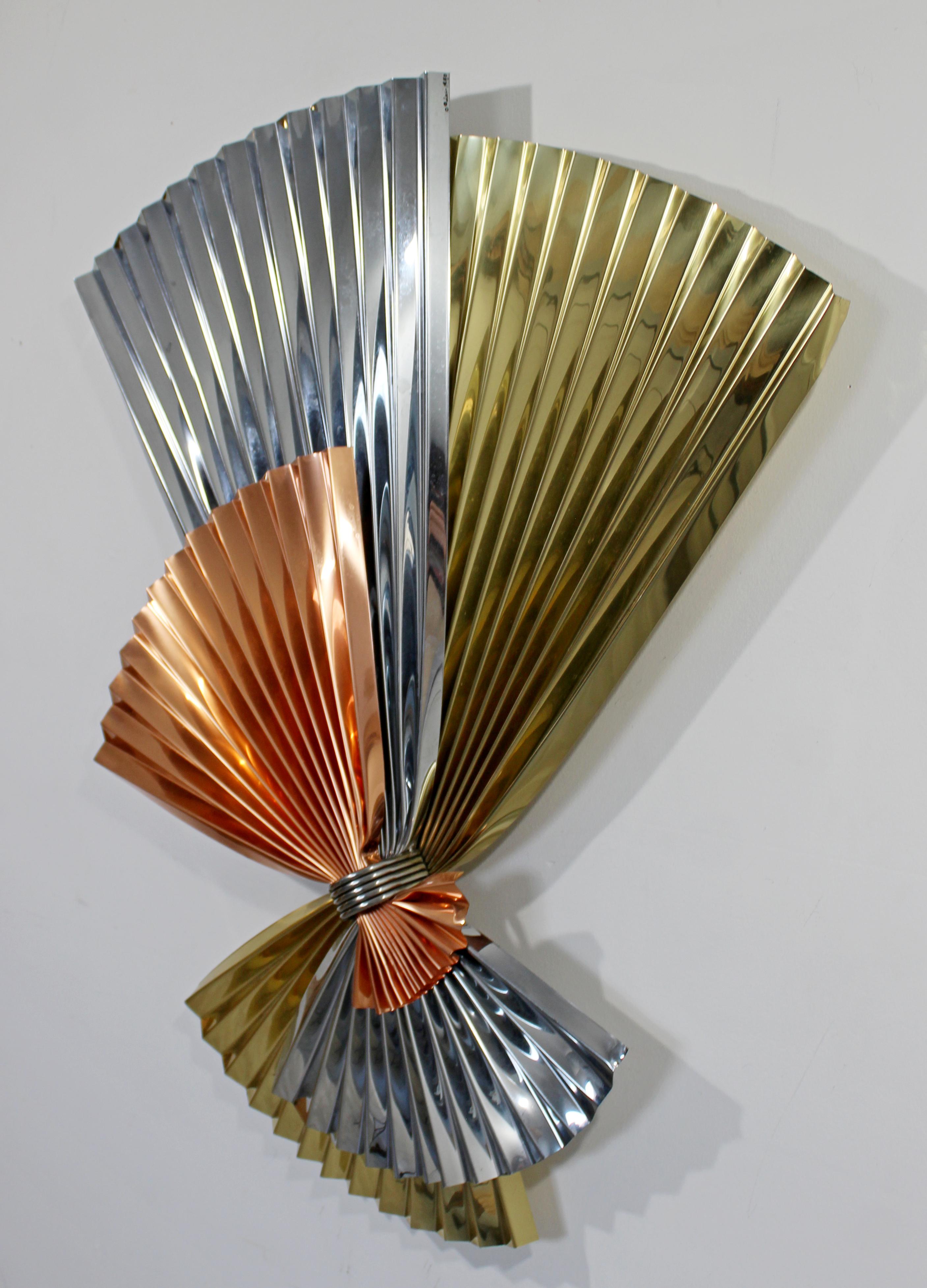 For your consideration is an extraordinary, tri-color metal fan wall sculpture, signed Curtis Jere and dated 1980. In excellent condition. The dimensions are 35
