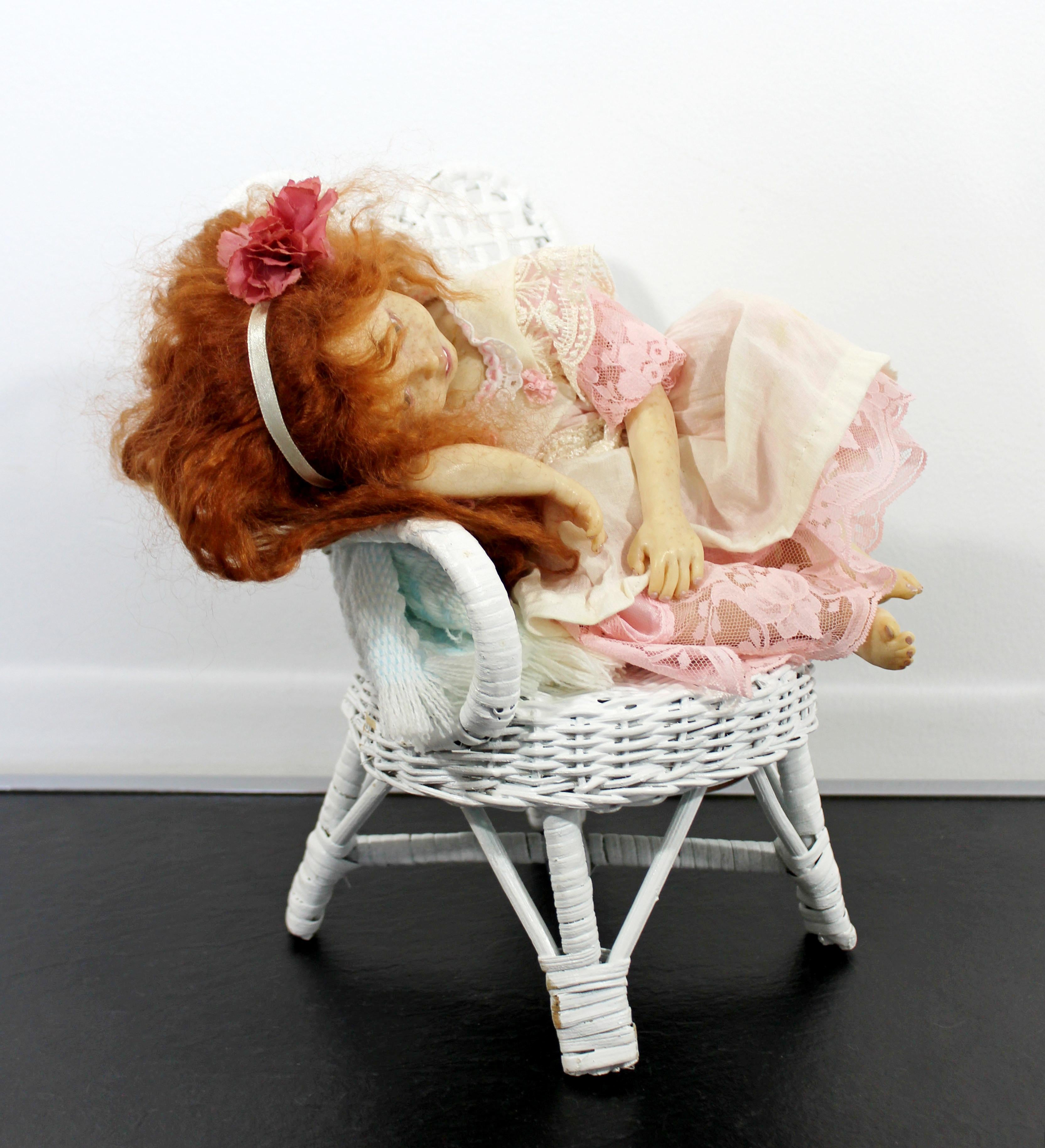 For your consideration is this polymer clay doll by Liz Shaw. Shaw's superb detail of sculpting, inset enamel eyes, original costume, with a wicker chair. In excellent condition. The dimensions are 9.5