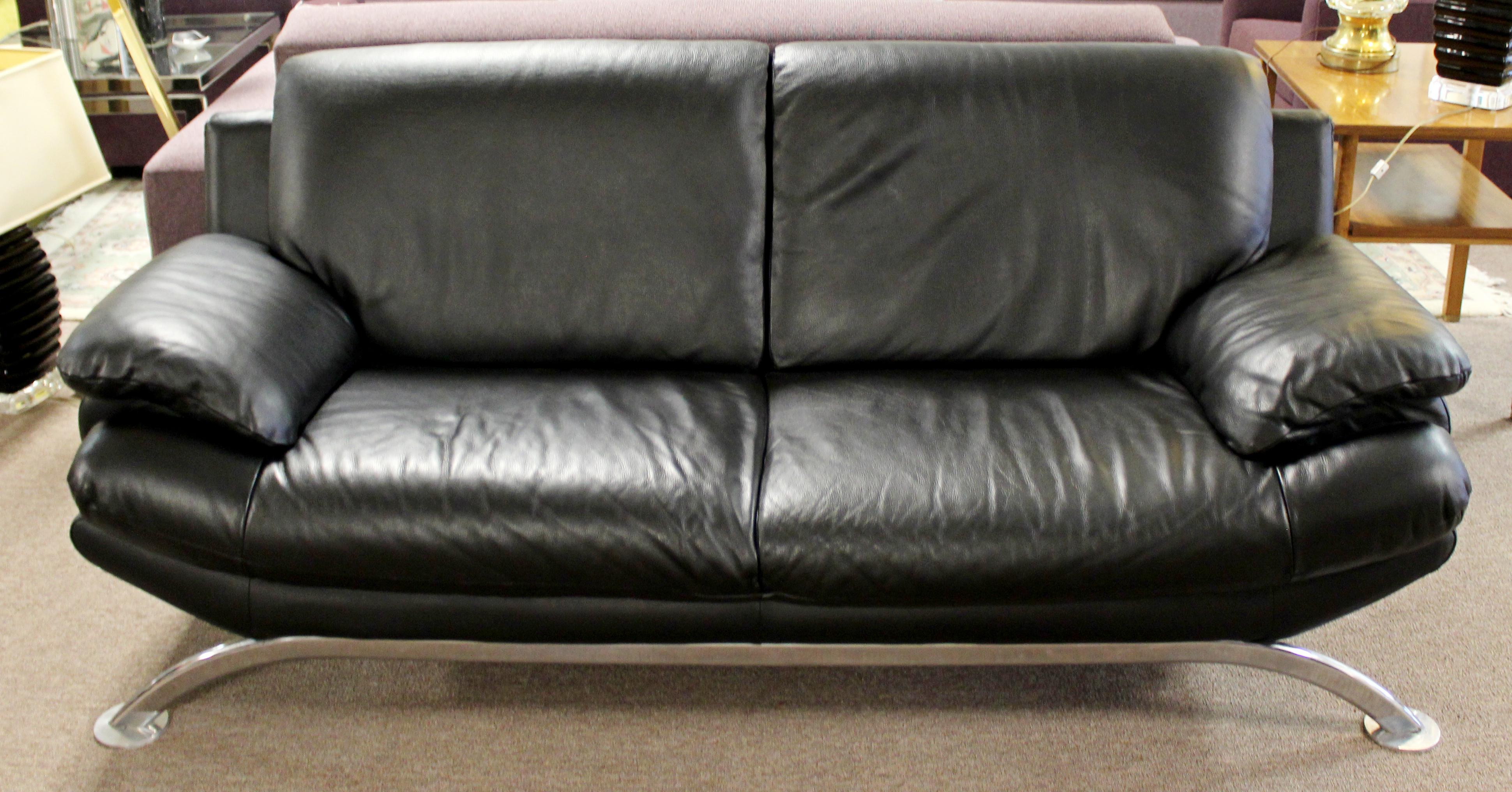 black leather sofa with chrome legs
