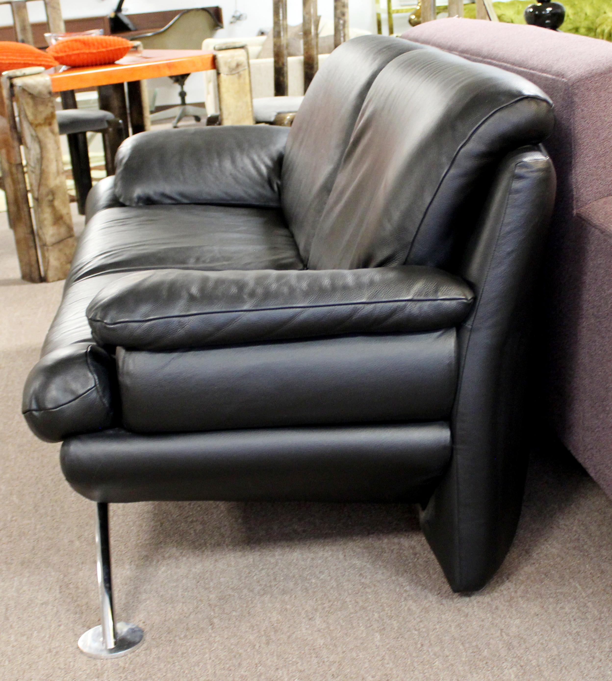 black leather sofa with silver legs