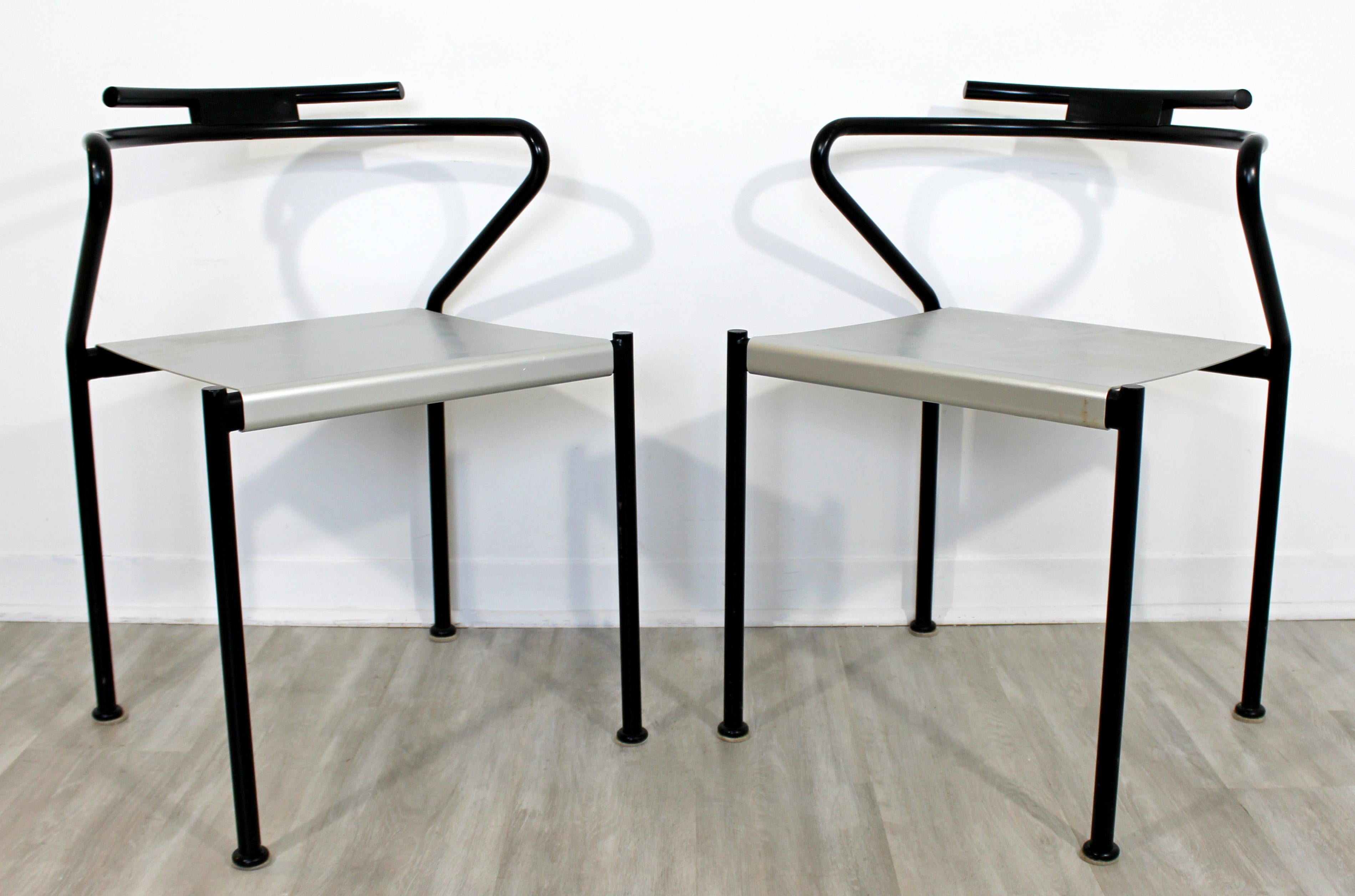 For your consideration is a stunning pair of Postmodern chairs with a black enameled steel frames and aluminum seats by Cidue, made in Italy, circa 1980s. In very good vintage condition. The dimensions are 20.5