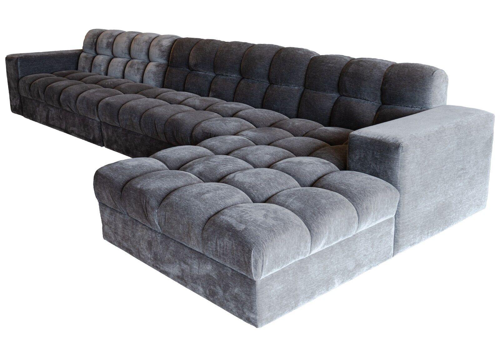 A contemporary modern custom made dark grey velvet tufted sectional sofa by Kravet. This outstanding sectional sofa features a unique tufted cushion design on both the seat and the backing. The texture this design creates provides for a wonderfully