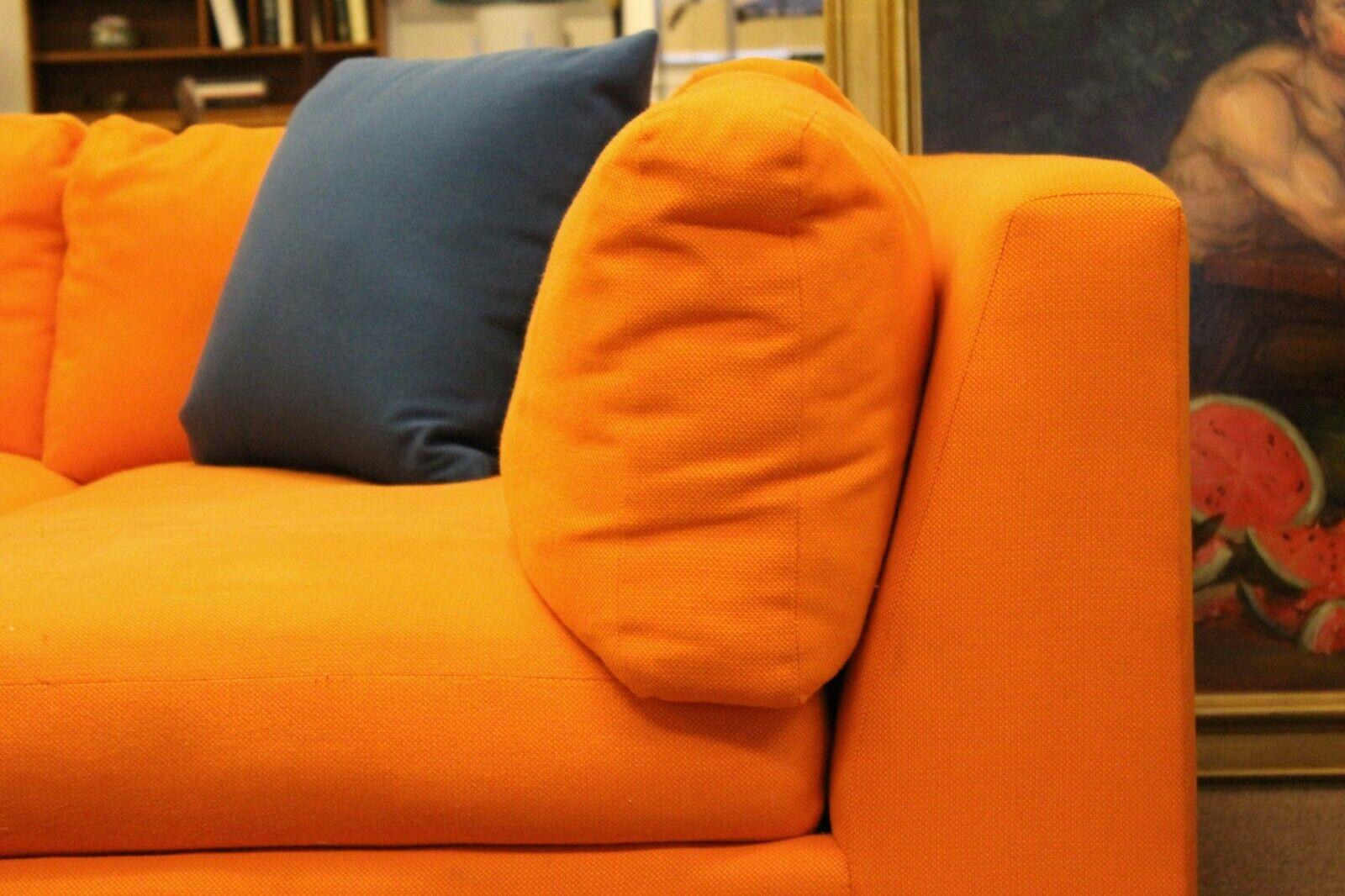 Fantastic and fun, this orange sectional sofa is custom made and ready for entertaining the whole family. The two pieces create an 'L' shape with the chaise on the right. 


The seat cushions are down wrapped, making this sofa very comfortable